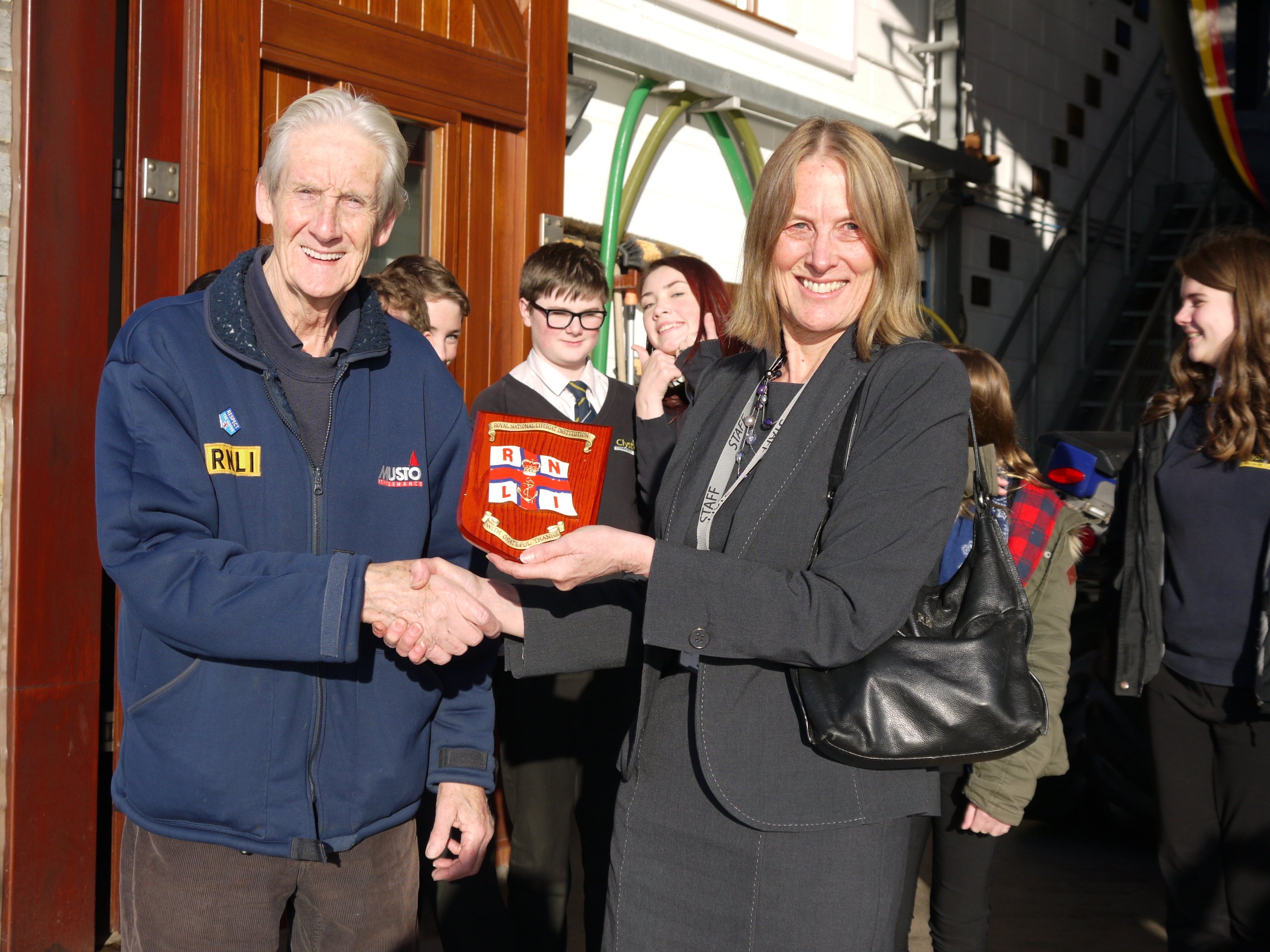 Fundraising Chair, Don Hodgkinson presents Head of History, Heather Padden with a plaque from the Institution