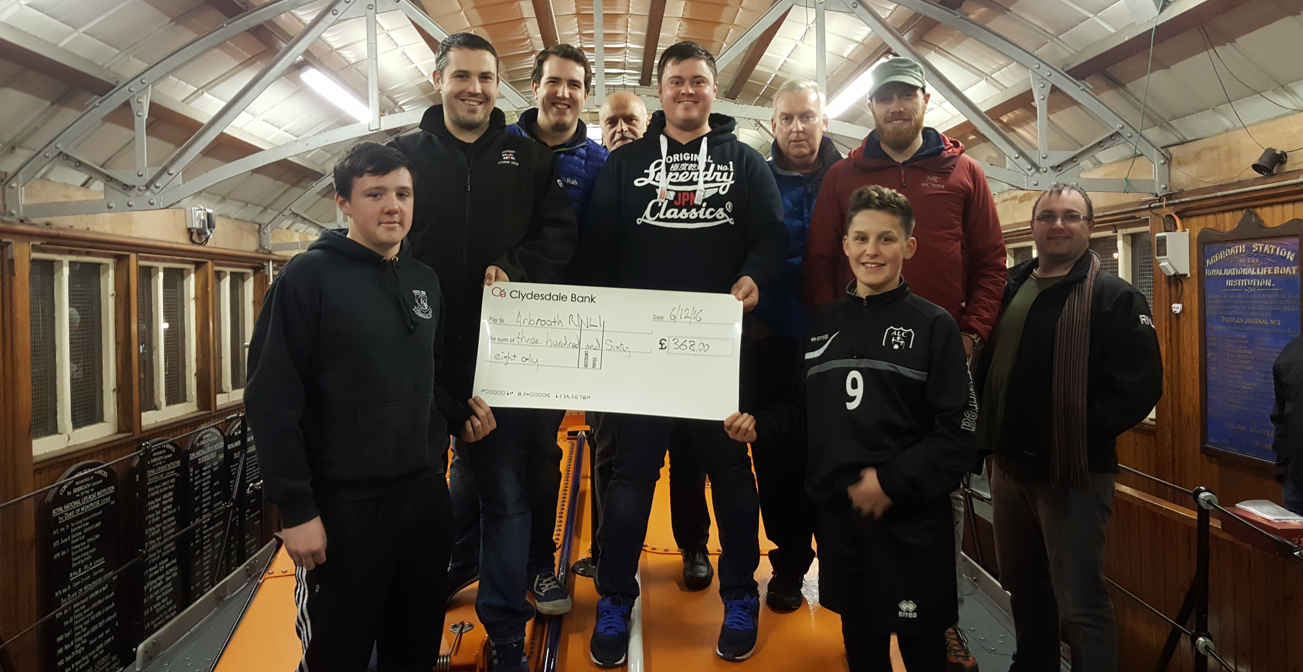 Bike run fundraisers visit Arbroath RNLI to present the cheque
