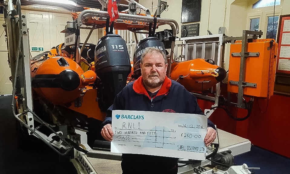 Peter Williams, Criccieth Lifeboat Operations Manager with the cheque