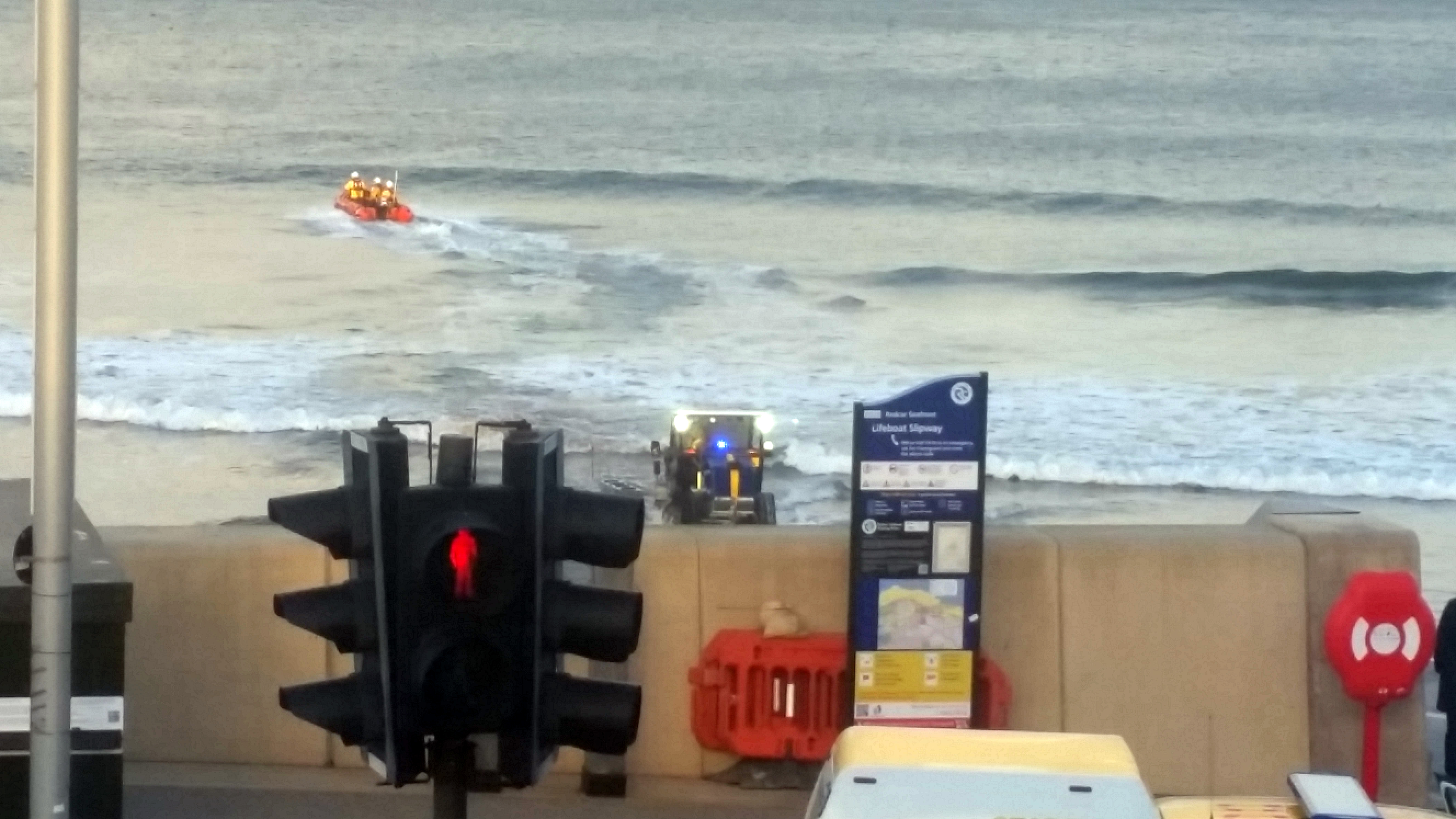 Redcar RNLI launching to recover kitesurfing equipment.