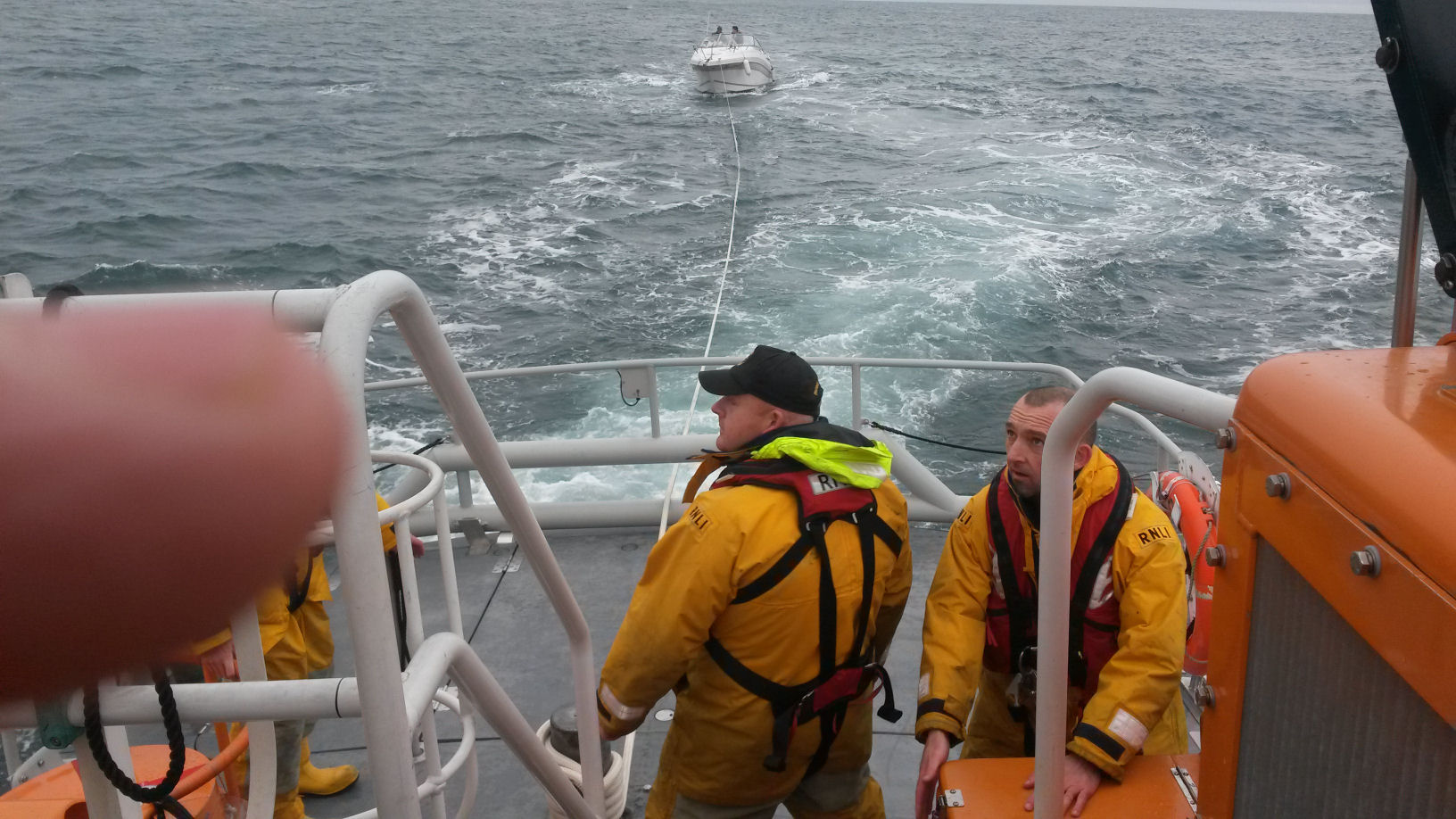 Pleasure craft being towed to Peterhead marina