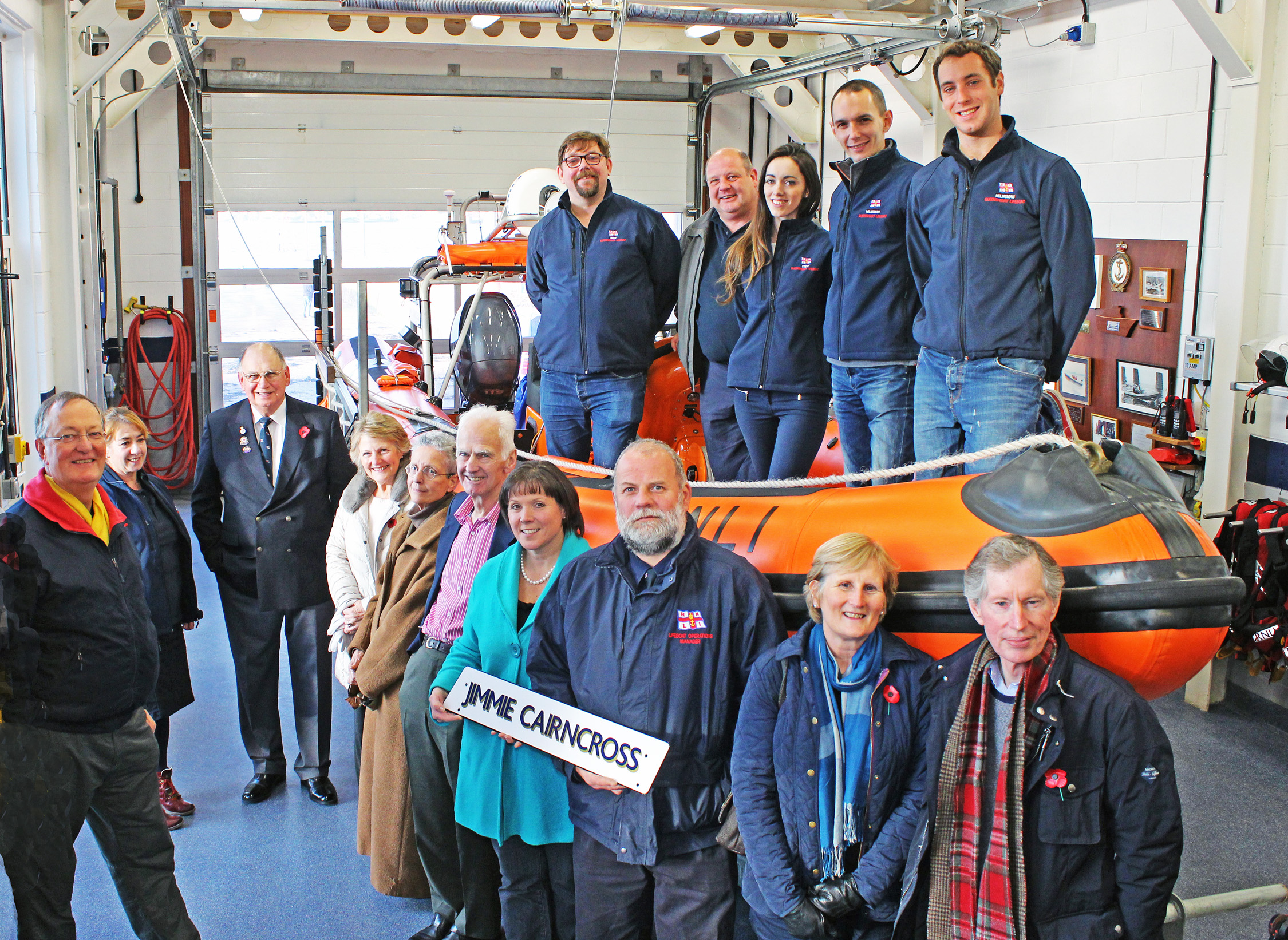Representatives of RNLI Queensferry Lifeboat Station, along with Trustees from the Jimmie Cairncross Charitable Trust in the boatshed at Queensferry Lifeboat Station. Pictured with Atlantic 85 Jimmie Cairncross inshore lifeboat. 