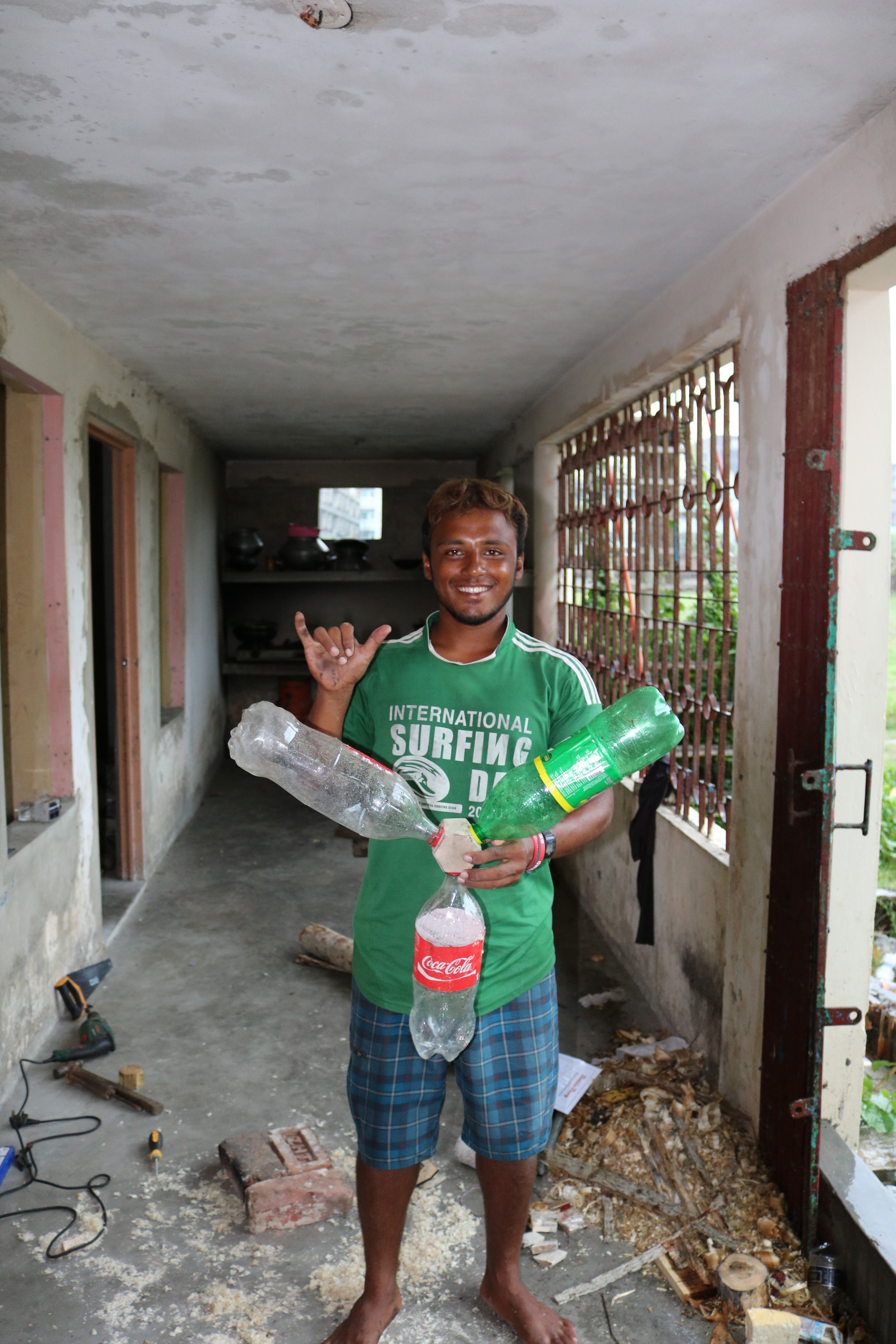 Alamgir with his finished bottle buoy in Cox's Bazar, Bangladesh