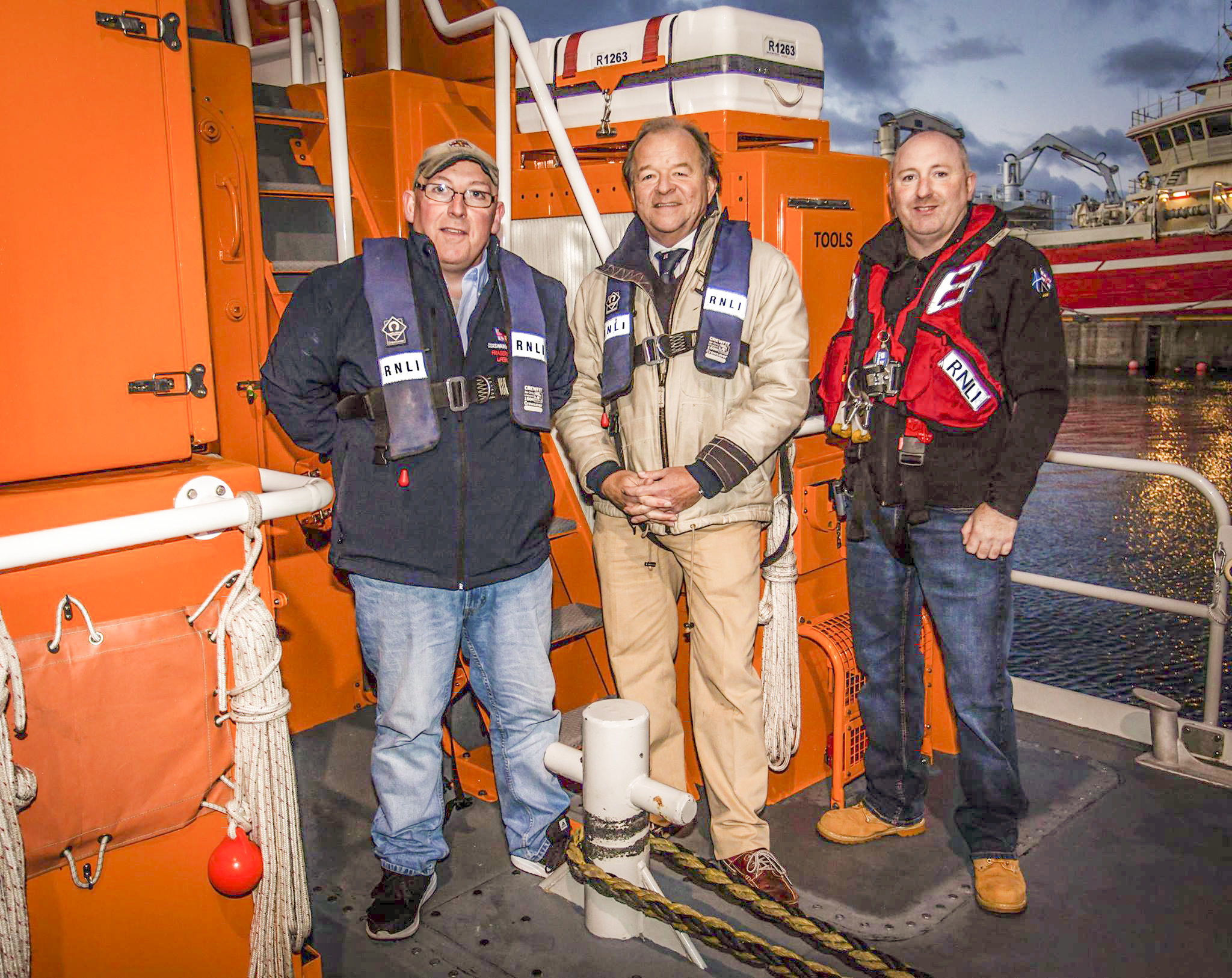 New RNLI Chairman Stuart Popham, Coxswain Vic Sutherland and new Lifeboat Operations Manager Hamish Partridge aboard Fraserburgh Lifeboat.