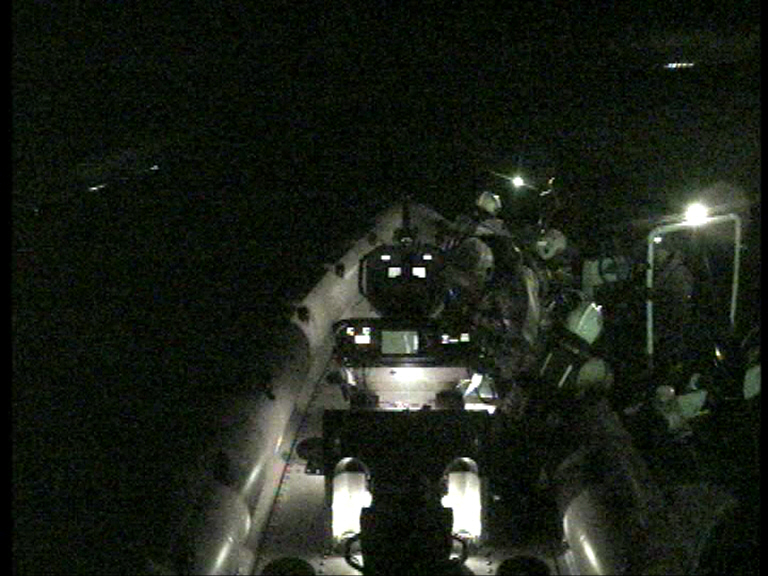 Blackpool RNLI volunteers can be seen in the Atlantic 85 lifeboat William & Eleanor alongside a small boat.