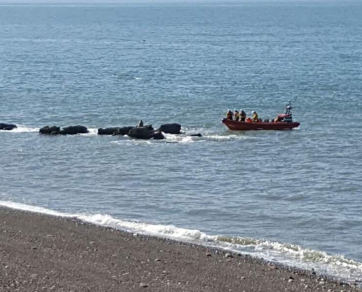 St Bees lifeboat approaching Tom Hurds Rock before taking off the stranded teenager