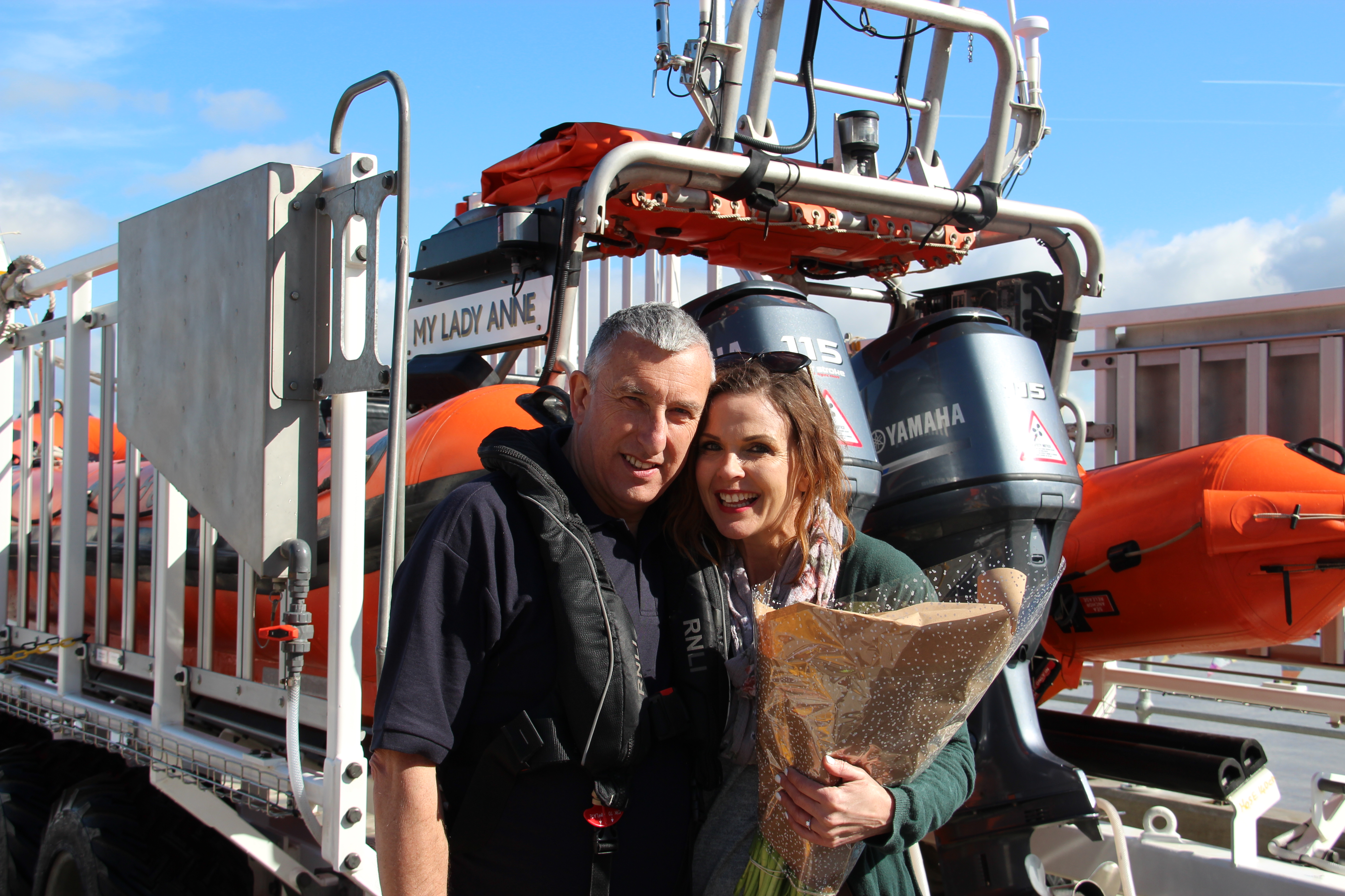 Andy and Becky stood by RNLI Portishead's Lifeboat My Lady Anne
