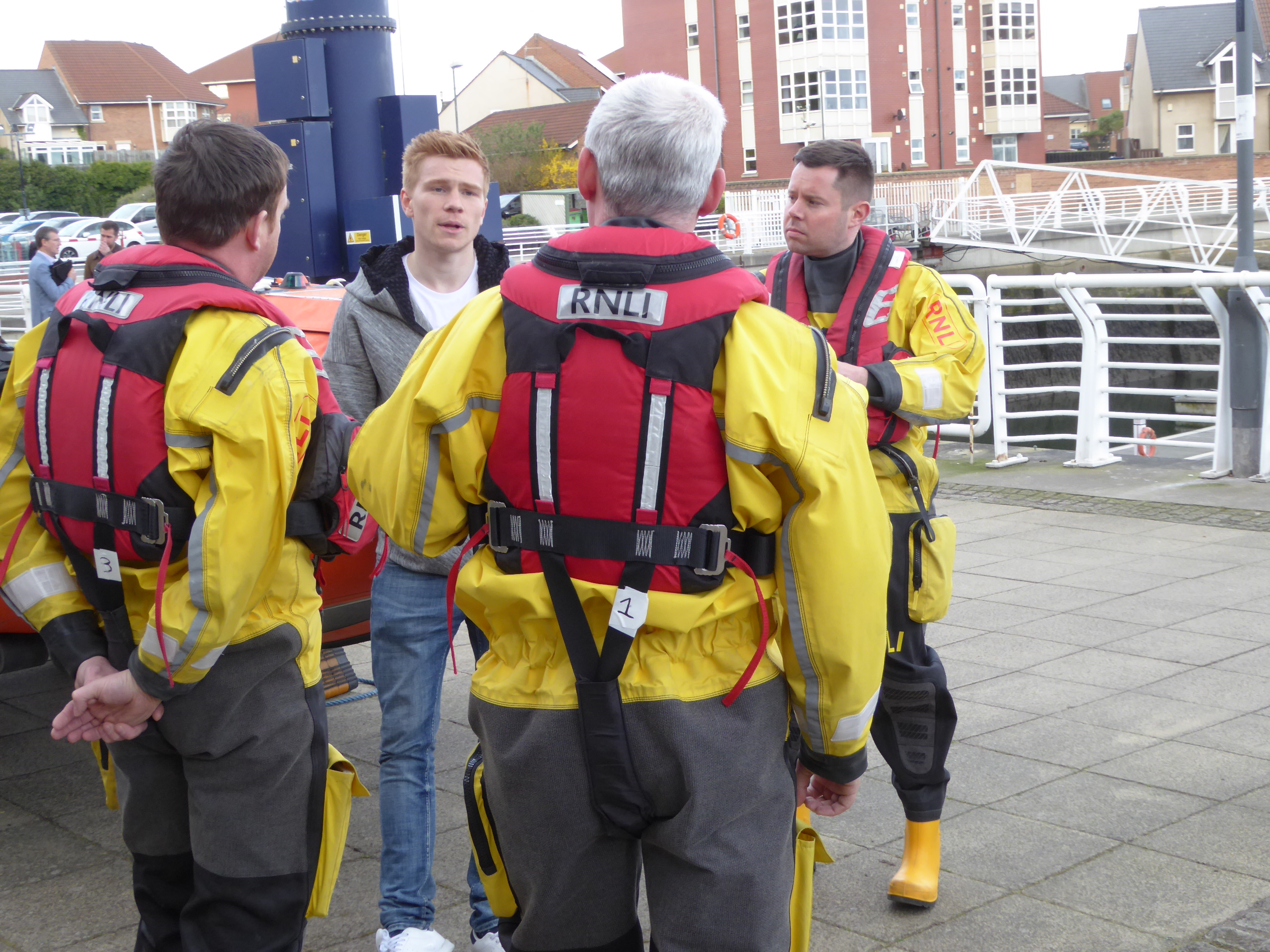 Duncan Watmore talking to Sunderland RNLI volunteers (Mark Cleminson, Andrew McGill, and Paul Nicholson) during his visit