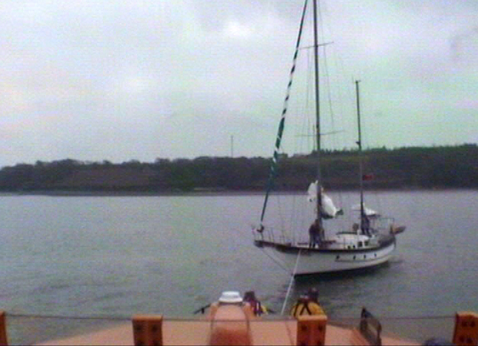 Angle RNLI's all weather Tamar class lifeboat Mark Mason tows the grounded ketch to safety off Pwllcrocham Flats in the Milford Haven Waterway on Sunday (April 9)