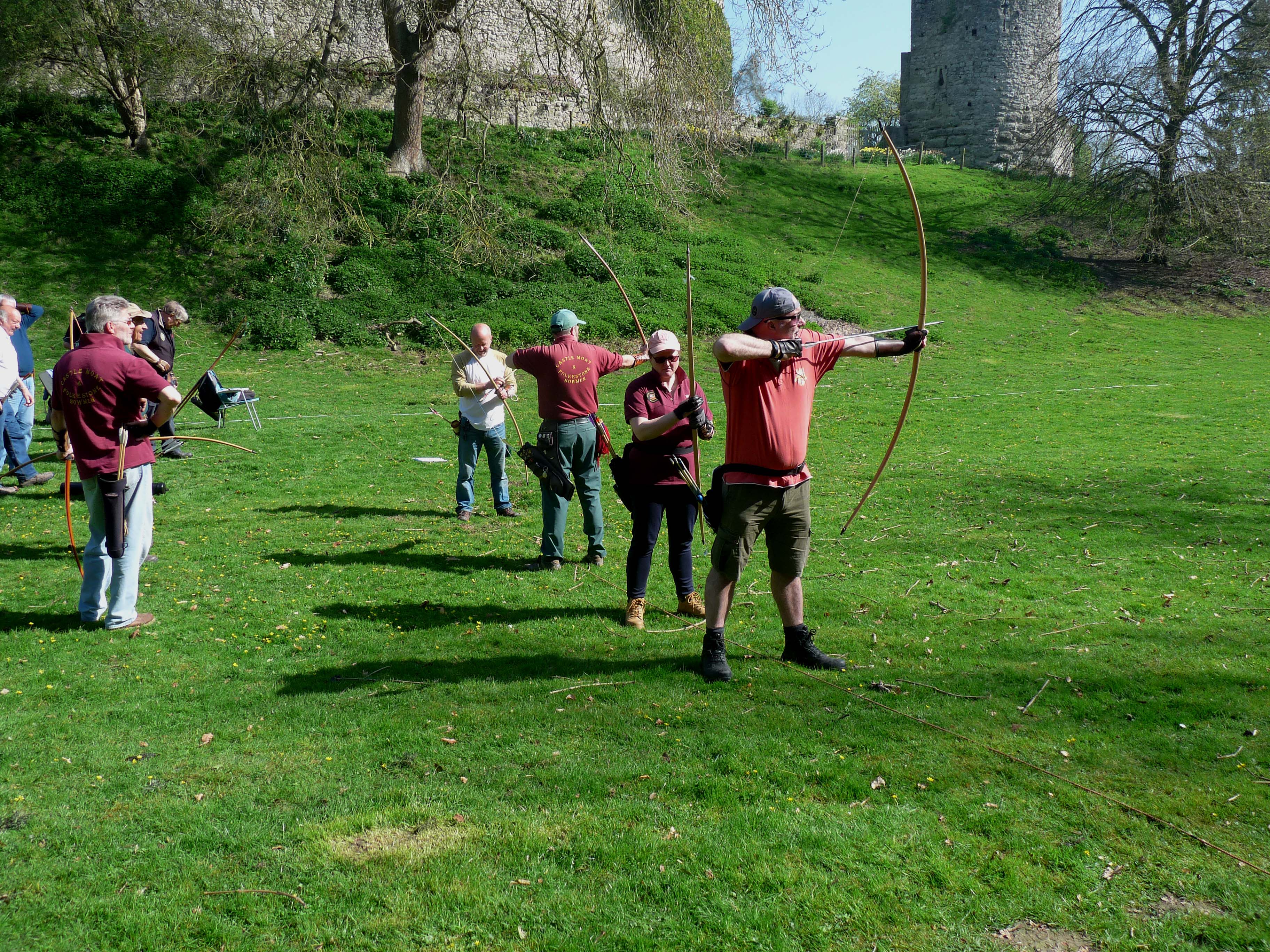 Archery club members in action