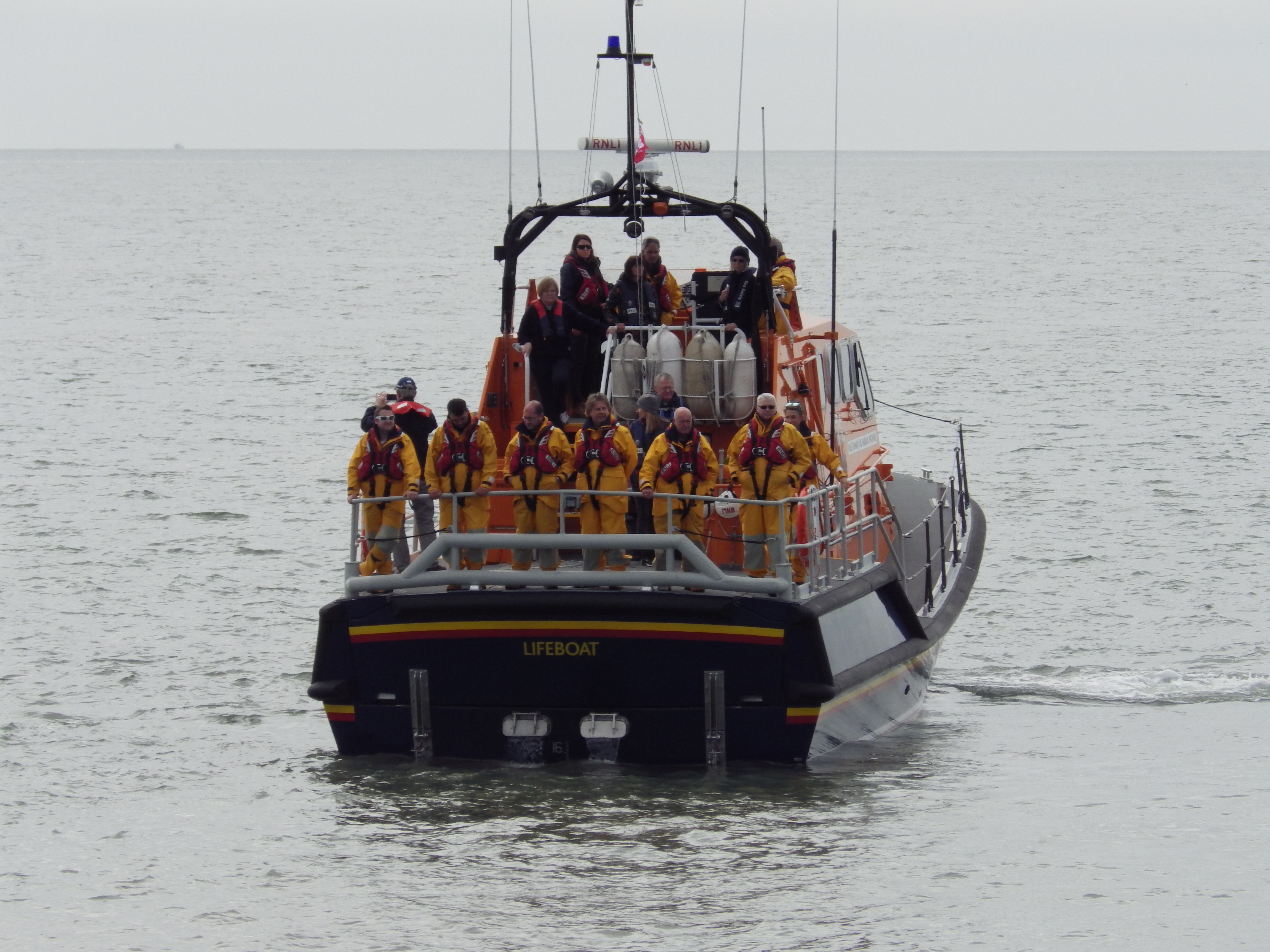 Current crew on board as wreaths are laid on the sea at Sker Point, Porthcawl
