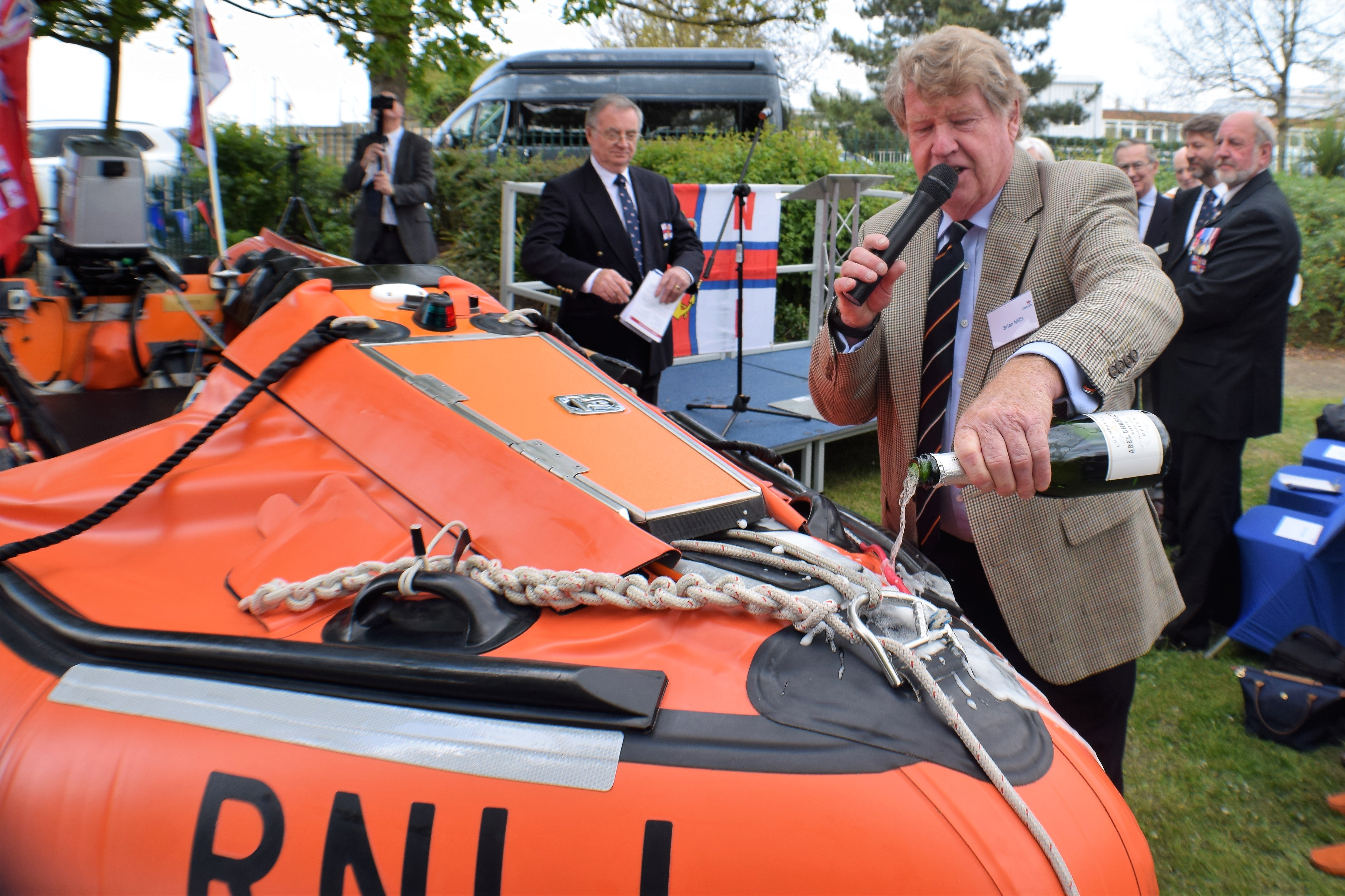 Mr Brian Mills son of Buster after who the new Sheerness ILB is named seen here 'doing the honours'