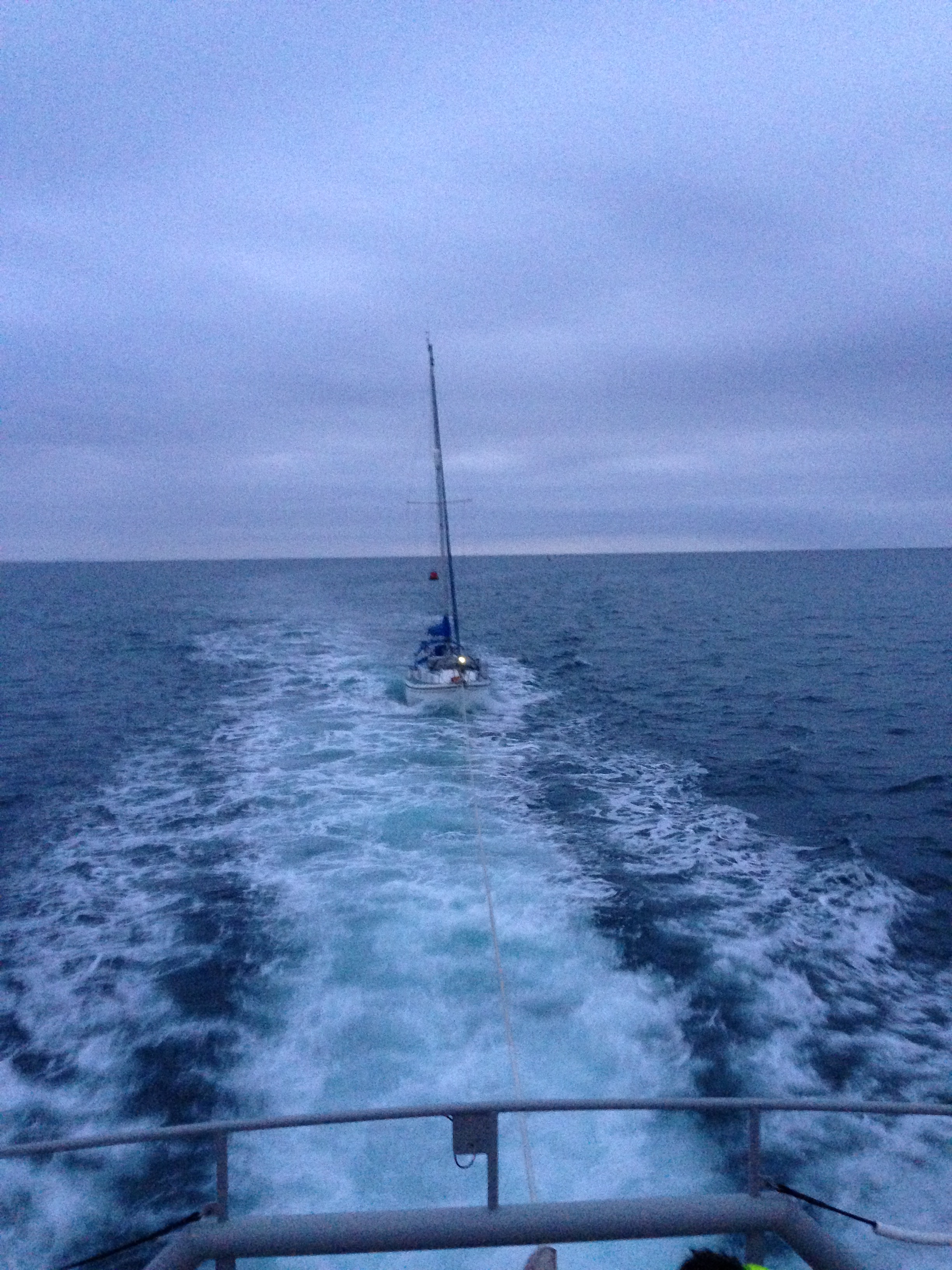 Porthdinllaen RNLI lifeboat towing the stricken yacht