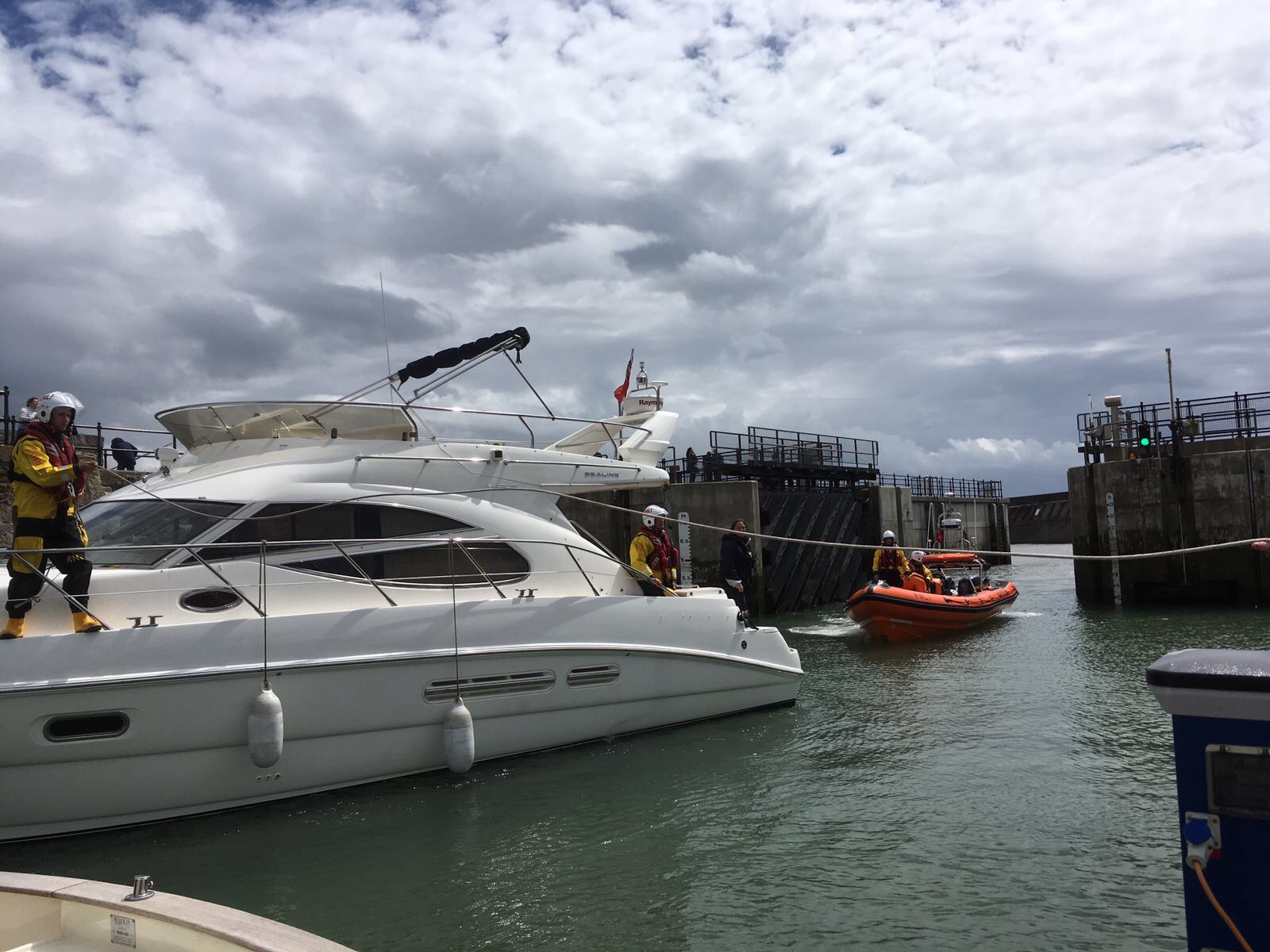 Crew assist with berthing the cruiser