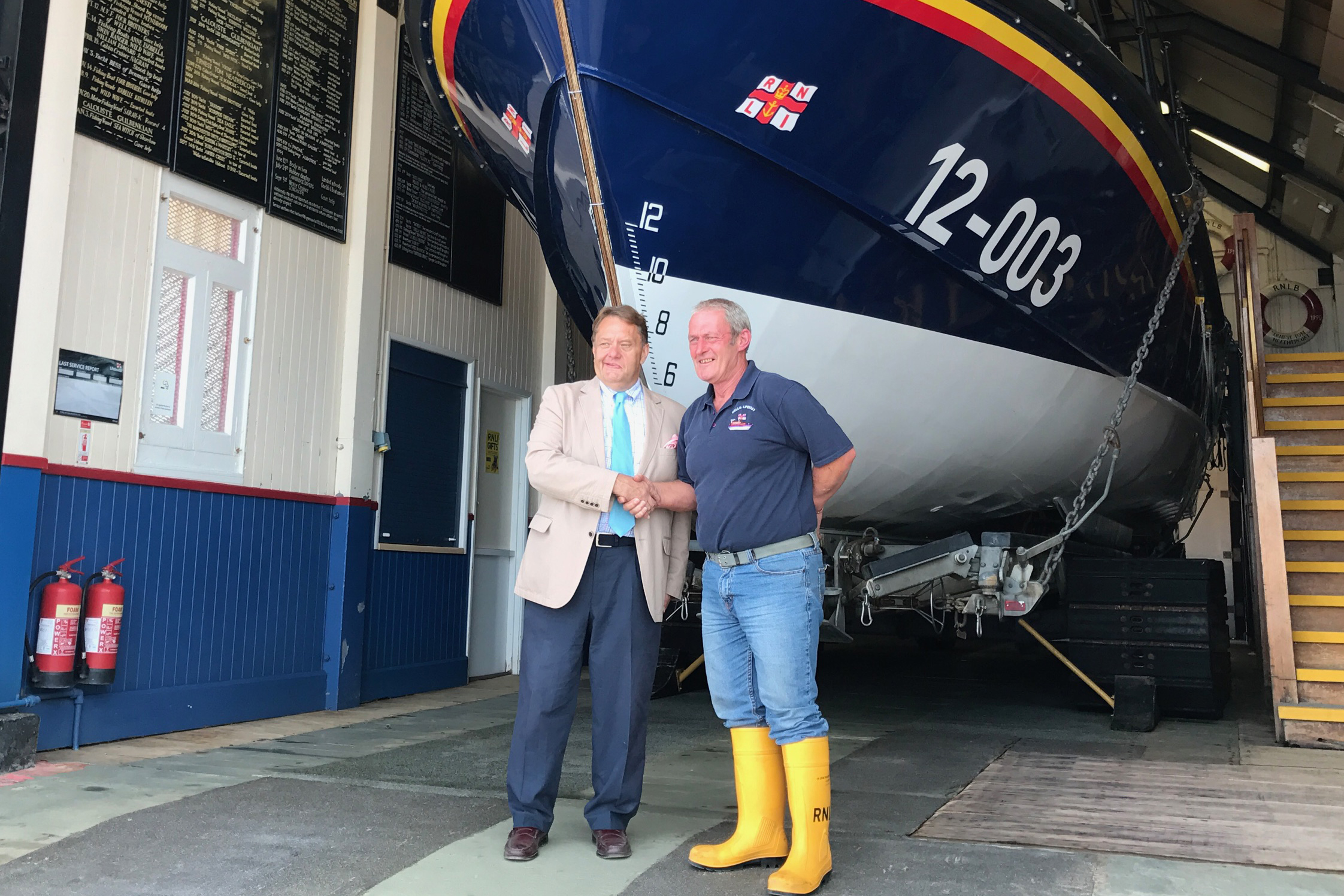 Shipping Minister John Hayes CBE MP with Wells RNLI Coxswain Allen Frary