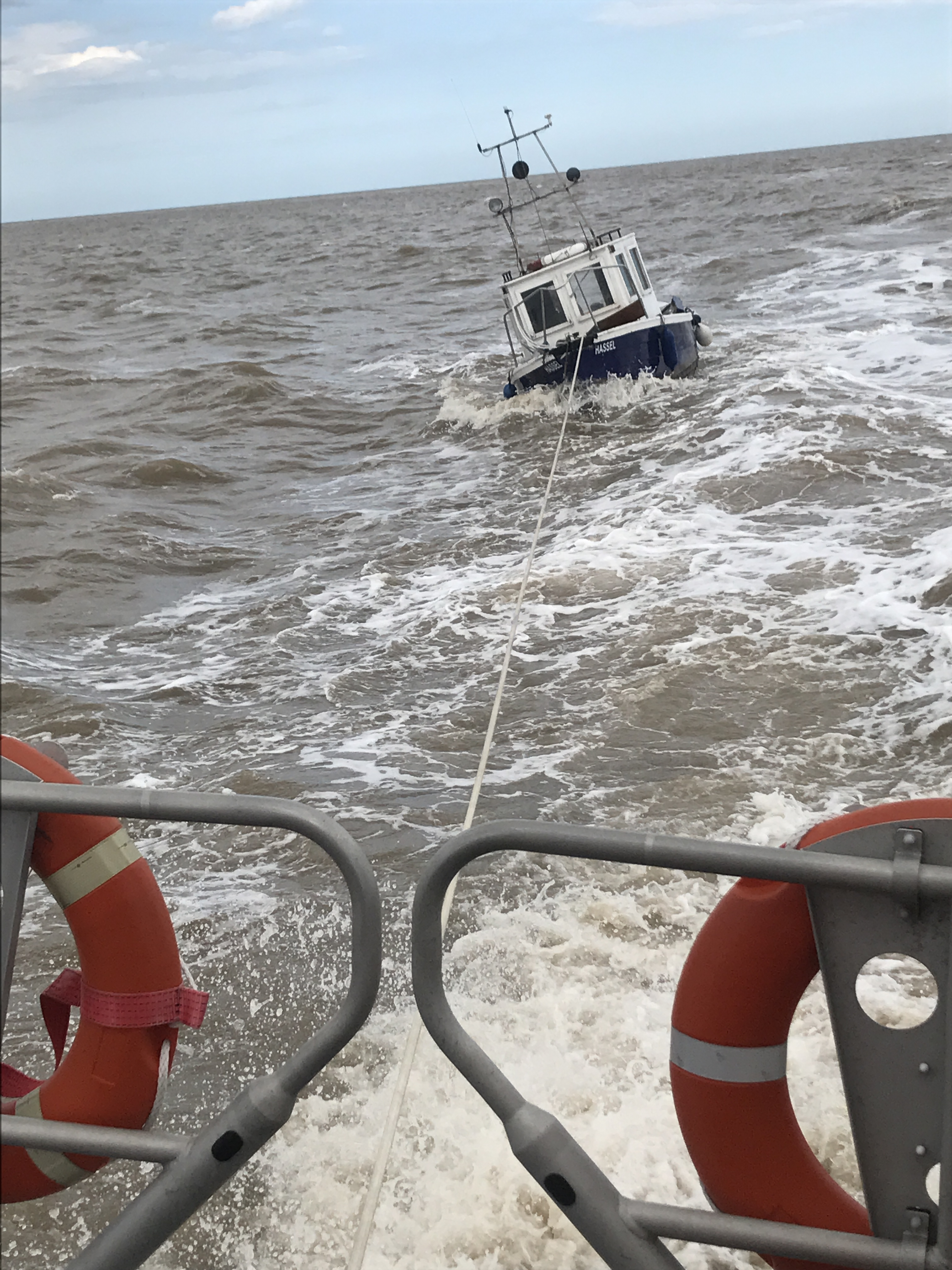 Lowestoft Relief Lifeboat 'Reg' tows the angling boat with engine failure back to harbour