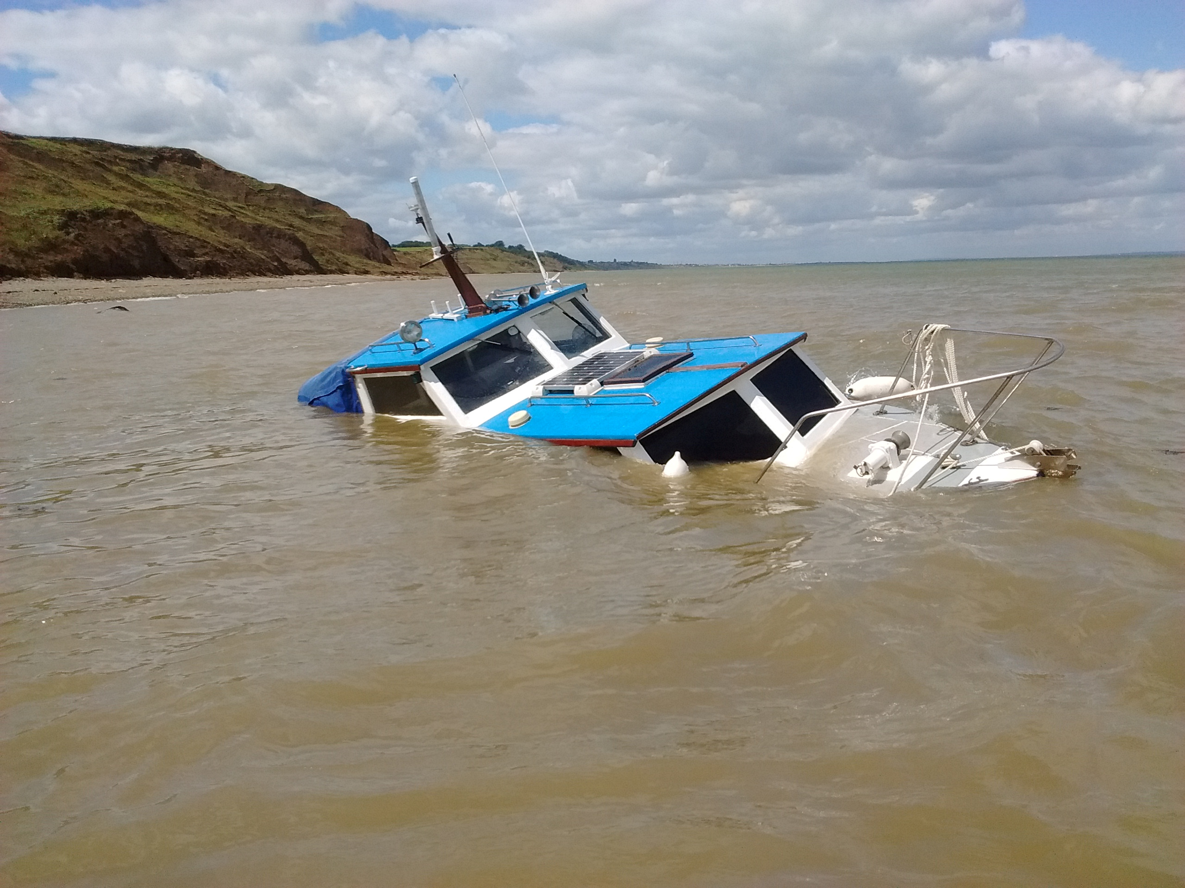 The beached 25-foot day cruiser west of Warden Point, Isle of Sheppey. Picture: RNLI Whitstable