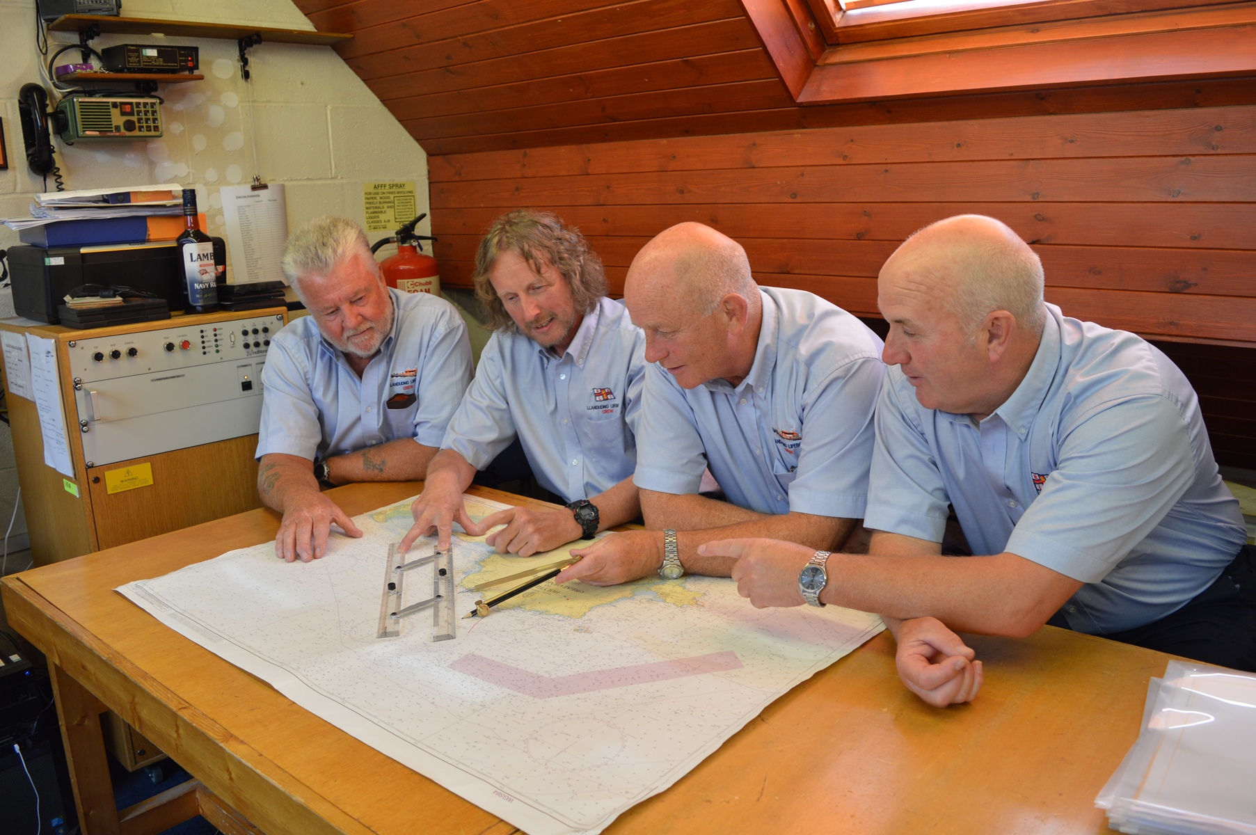 (L to R) - Former Coxswain (now Head Launcher) Dan Jones MBE, present Coxswain Graham Heritage, former Coxswain (now Training Co-ordinator) Robin Holden, and long-serving crewman Dave Roberts.