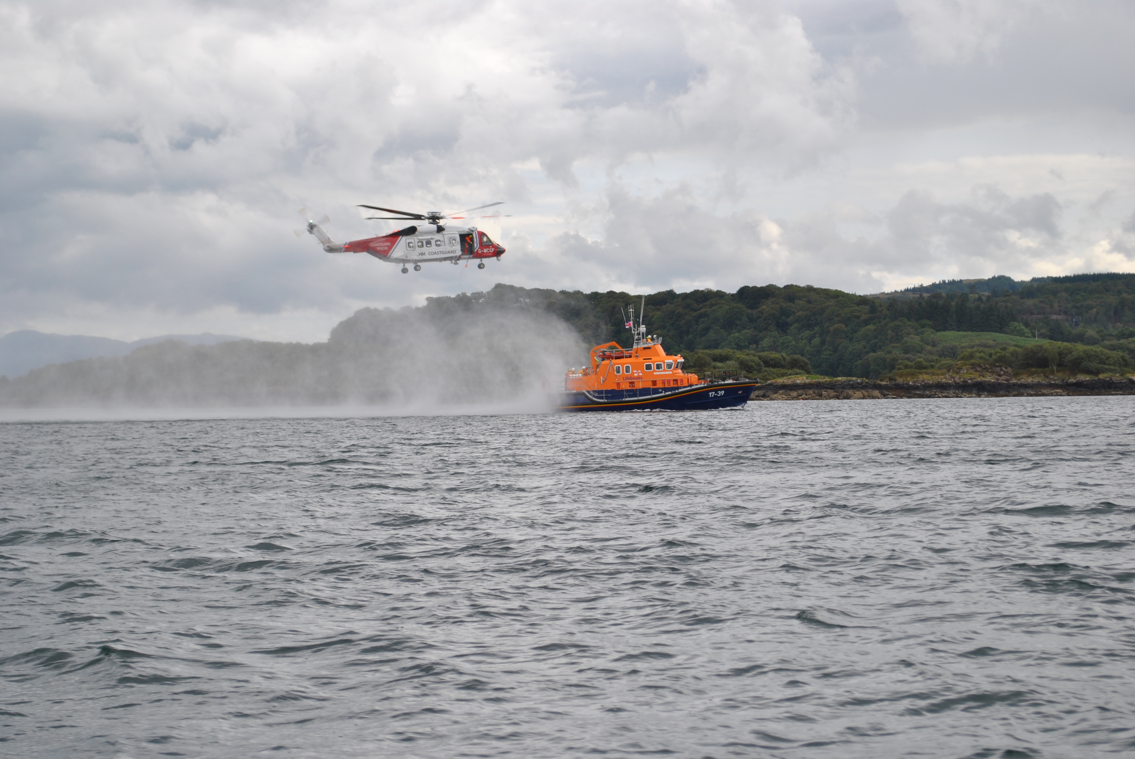 Coastguard helicopter exercising with the lifeboat