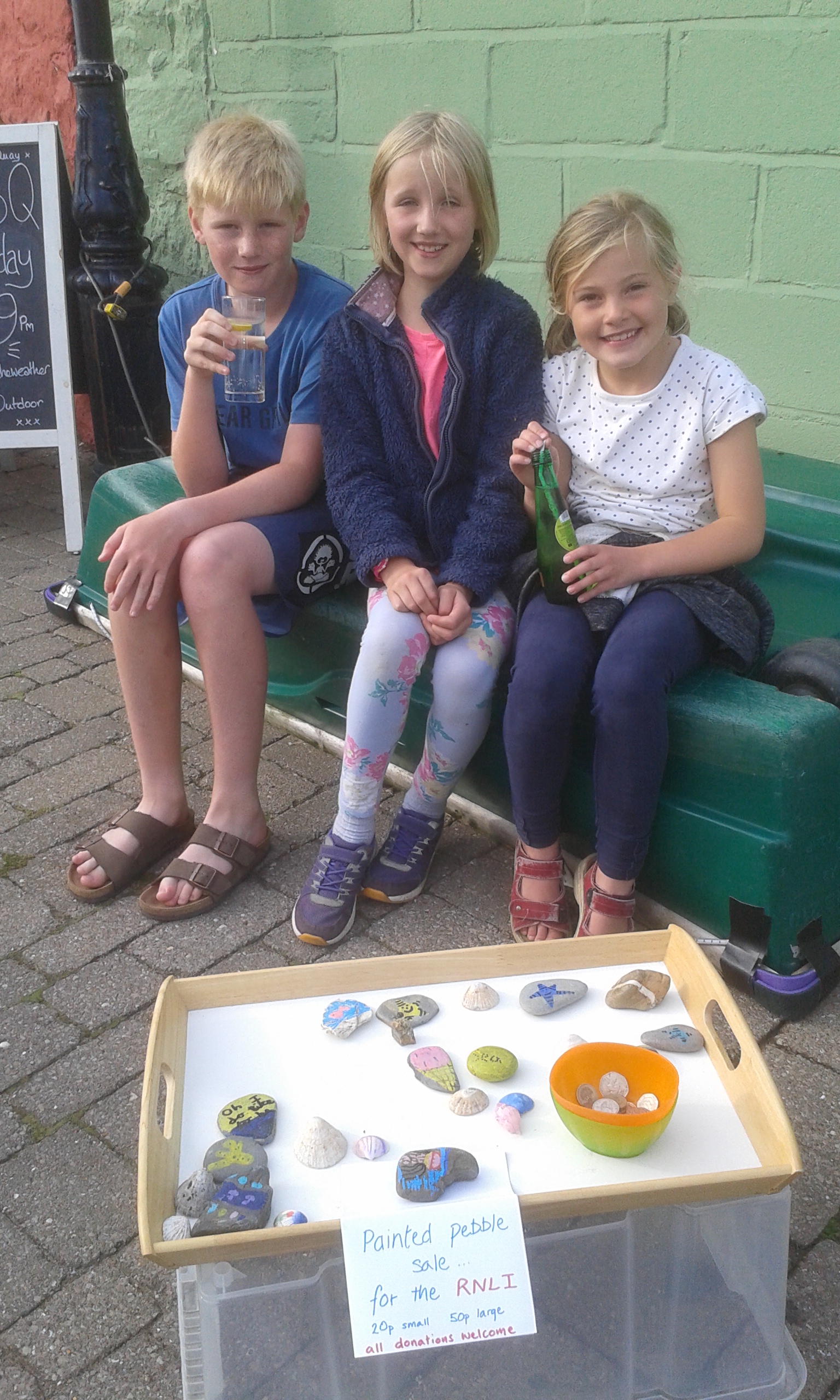 Jemima Leatt and Esther Toward, who live in Wells and Southampton, collected pebbles, hand painted them and set up a small stall on the quay to sell them to passers-by on the quay and raised nearly £30.00