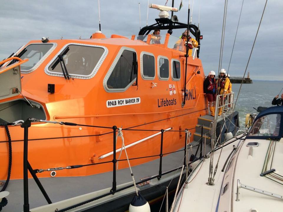 Lifeboat moors yacht at Marina 