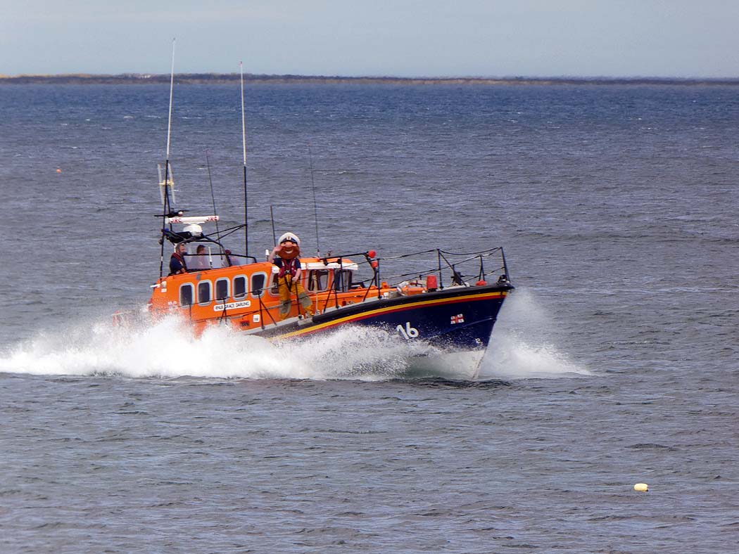 Seahouses Lifeboat displays to the crowds, Stormy Stan on deck.