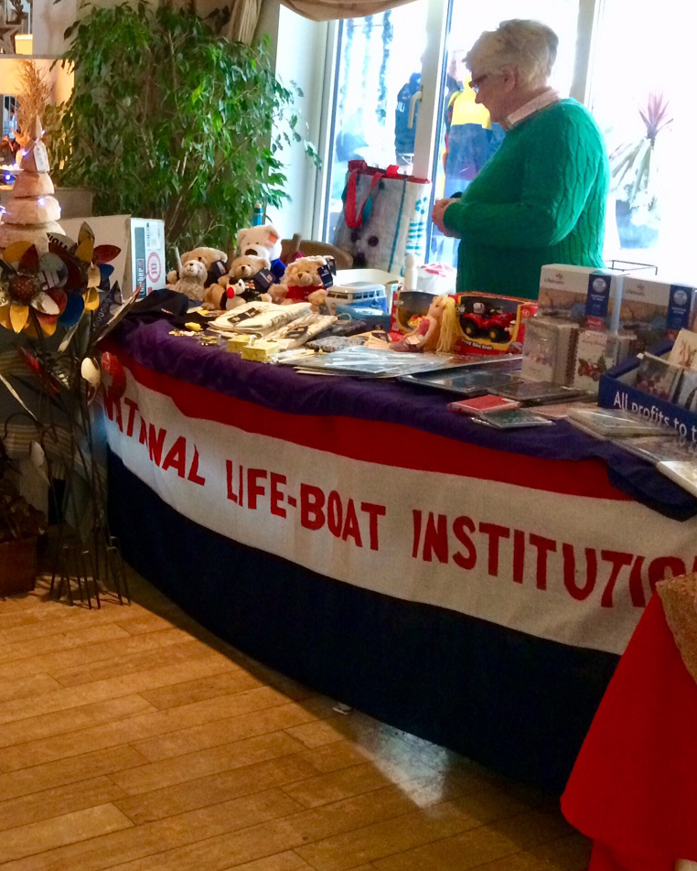 Stall manned by volunteers at the Little Gloster.