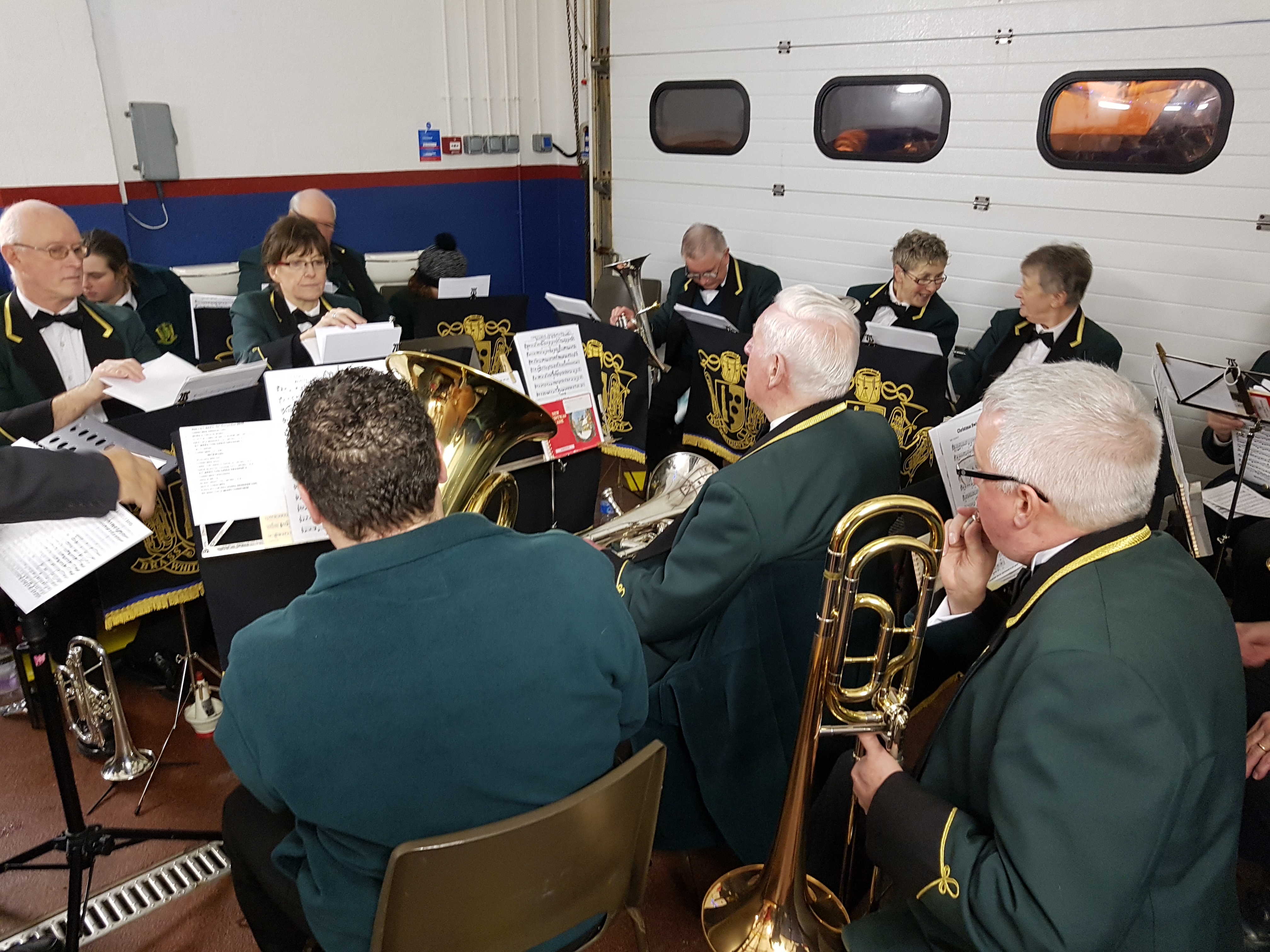 Whitehaven Brass Band warming up at the start of the evening