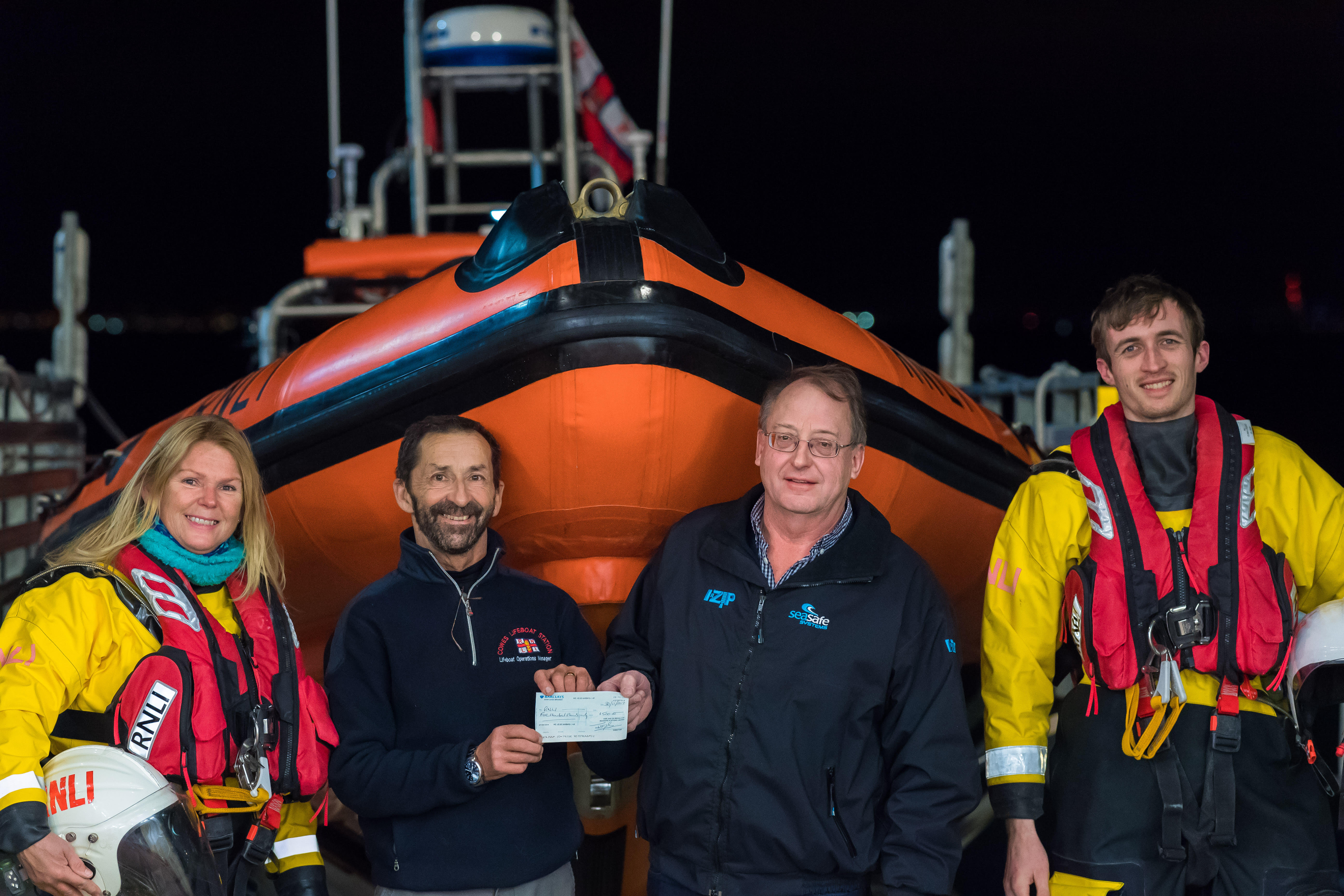 Cheque presentation to Mark from Seasafe managing director Jeremy Dale, with crew members Andrea Vaughan and Myles Hussey also in attendance.