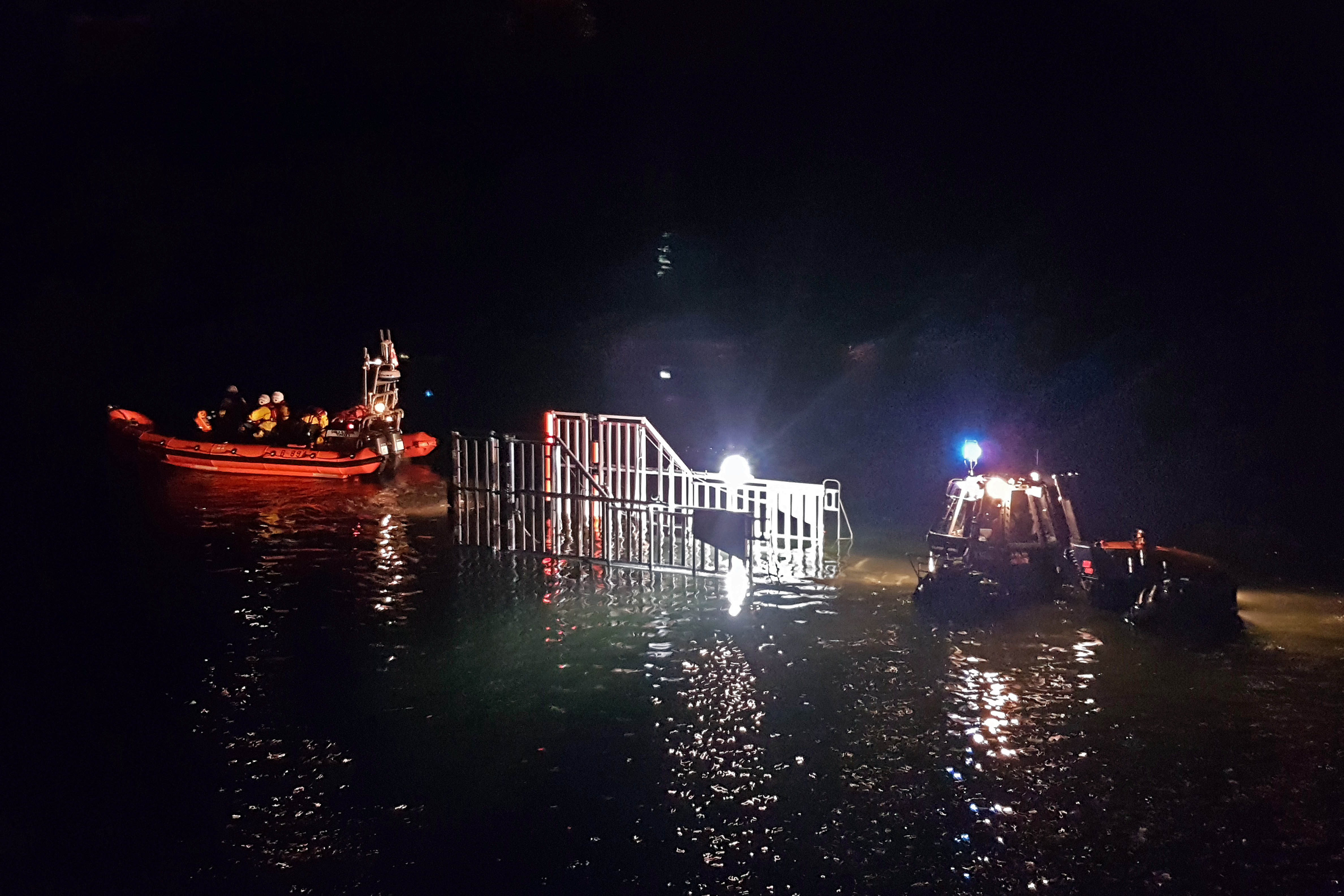 Stock image of Looe RNLI Atlantic 85 Sheila and Dennis Tongue II launching at night