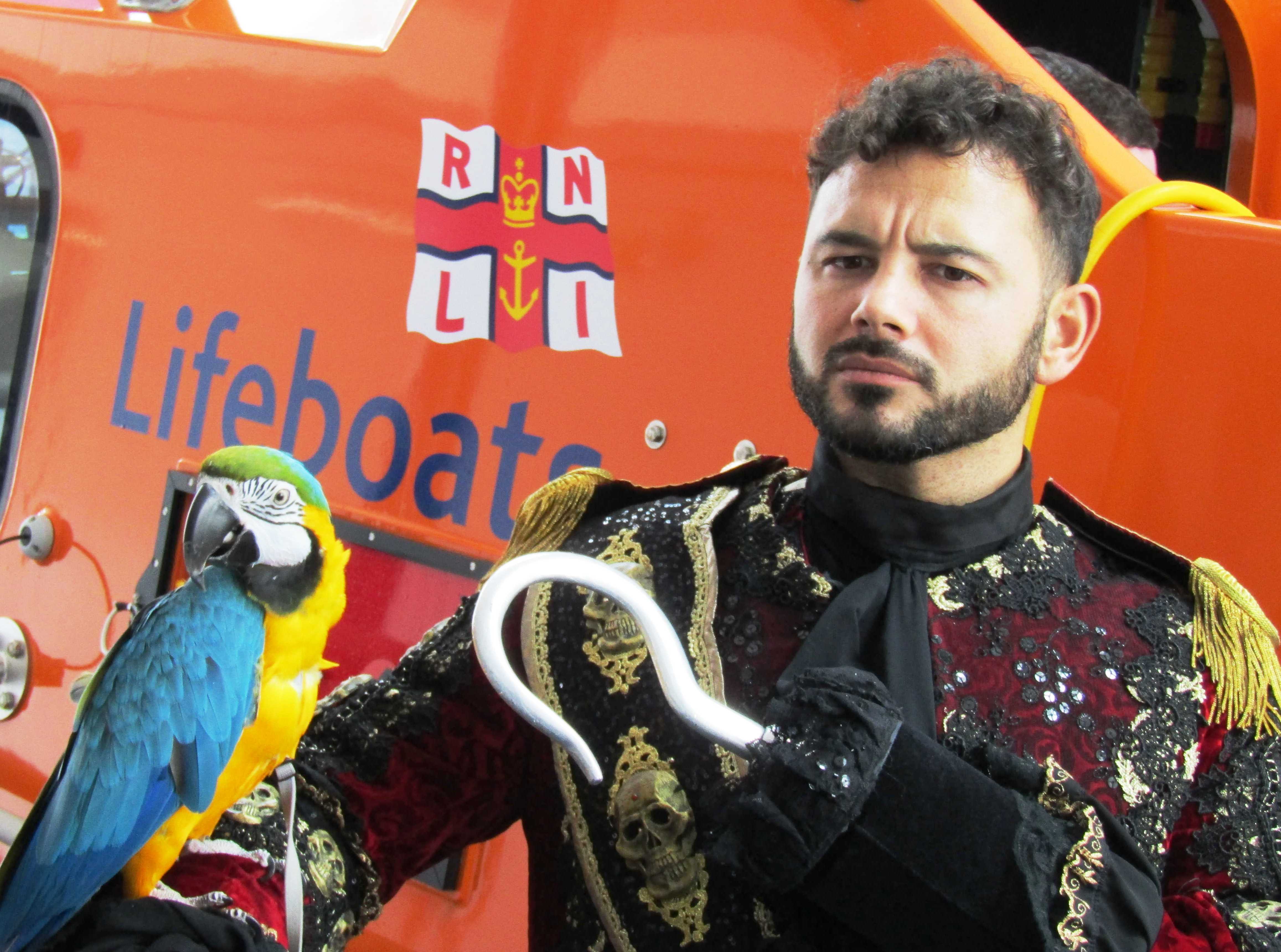 Coronation Street star Ryan Thomas took time out from panto at Venue Cymru to wish Llandudno RNLI crew a Merry Christmas