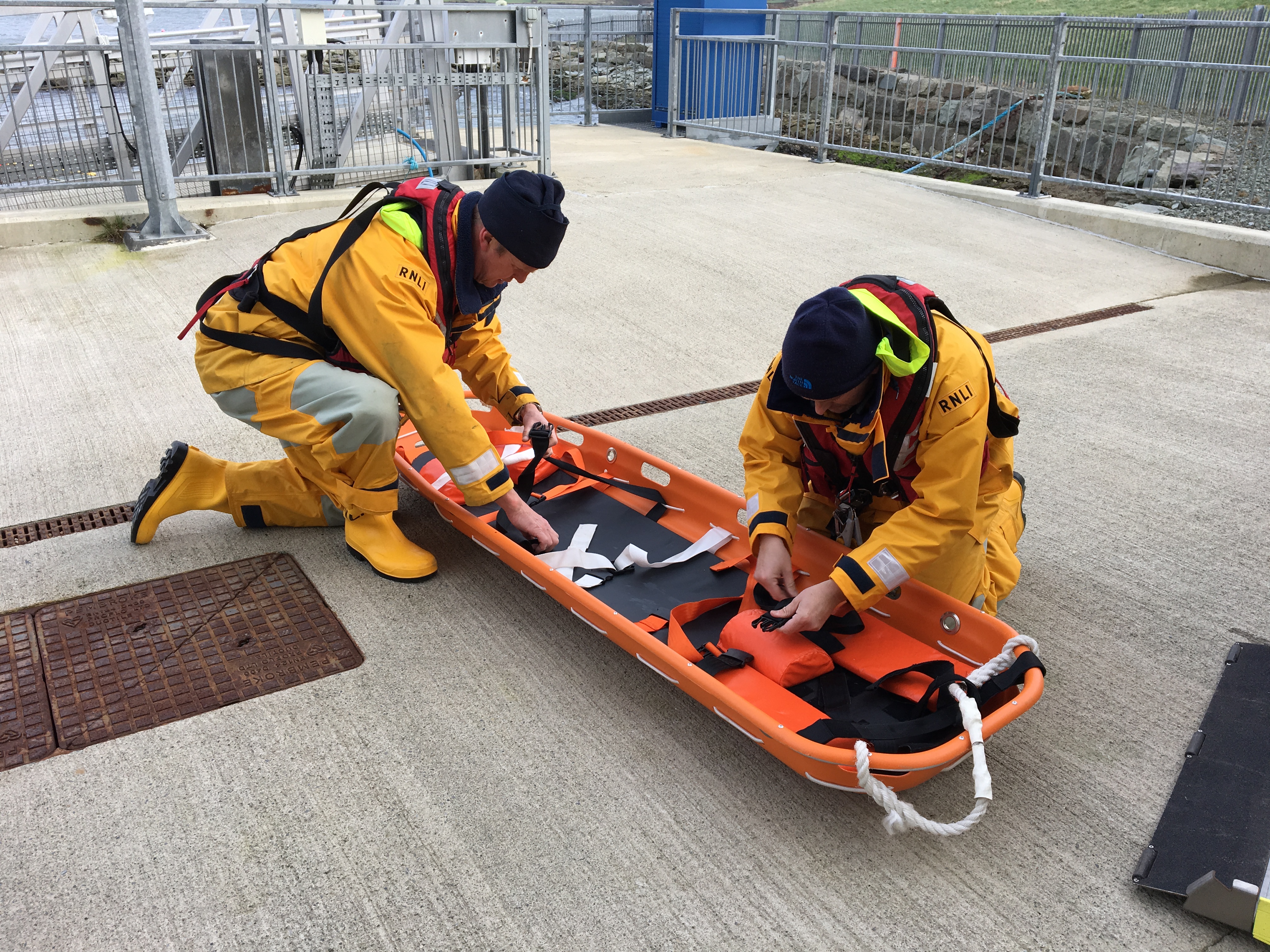 Lifeboat crew ready stretcher for medivac