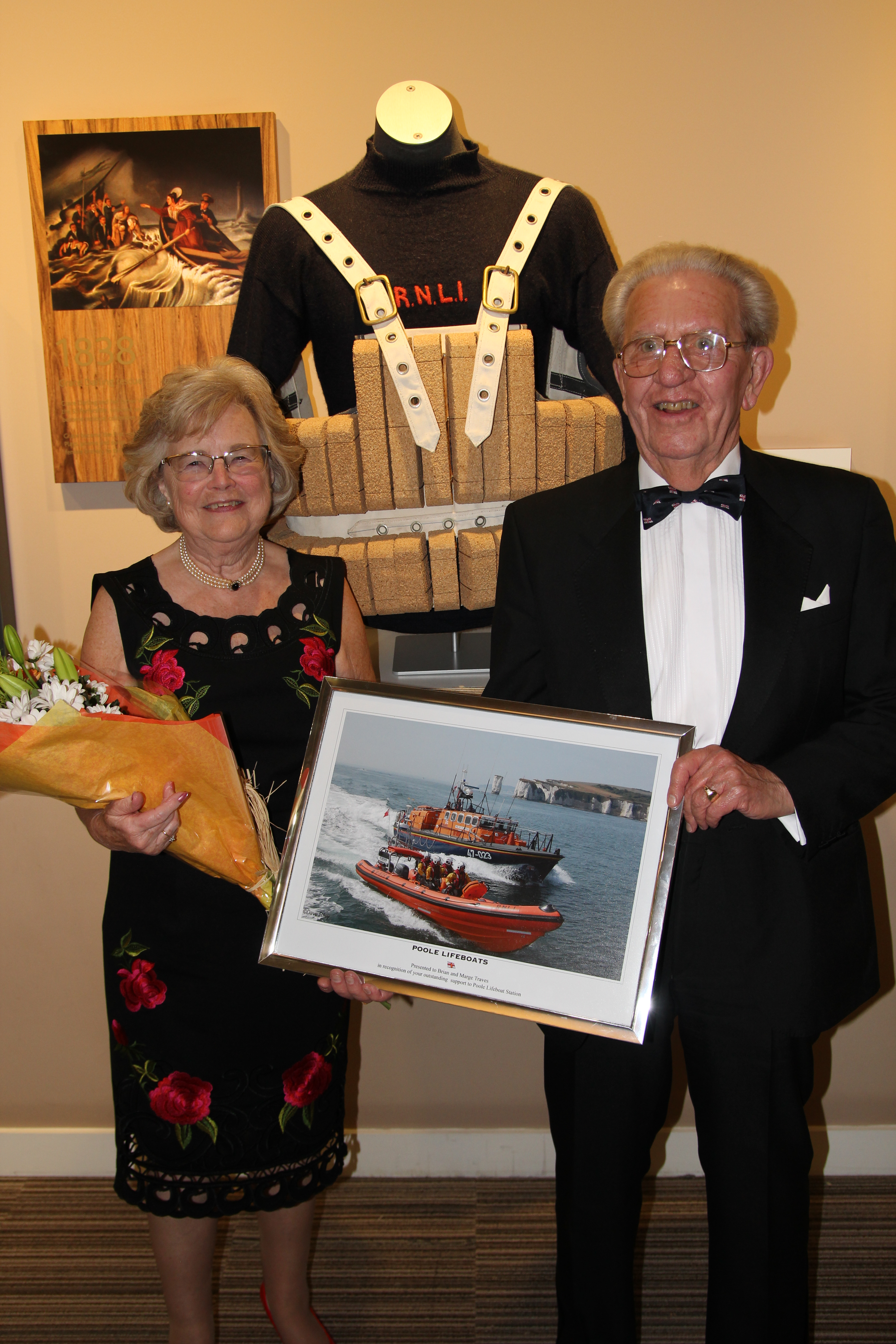 Marge and Brian at Poole Lifeboat Station Annual Dinner receiving a gratitude of thanks from the Poole lifeboat crew for all that they have done.