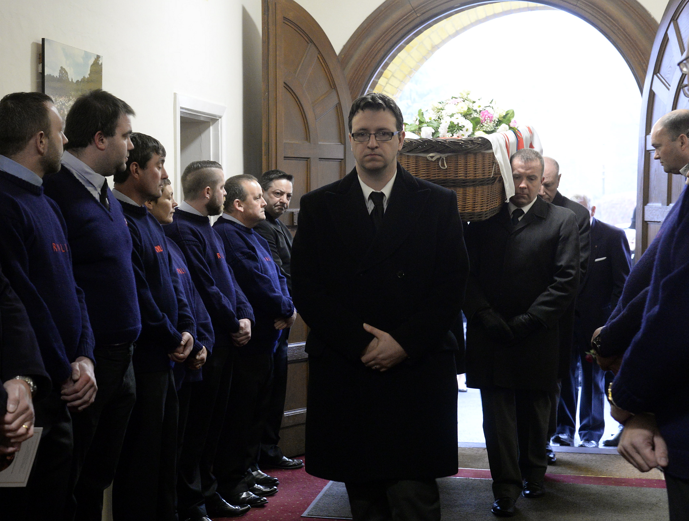 Members of the crew provide a guard of honour at the funeral of Diane Lamberton.