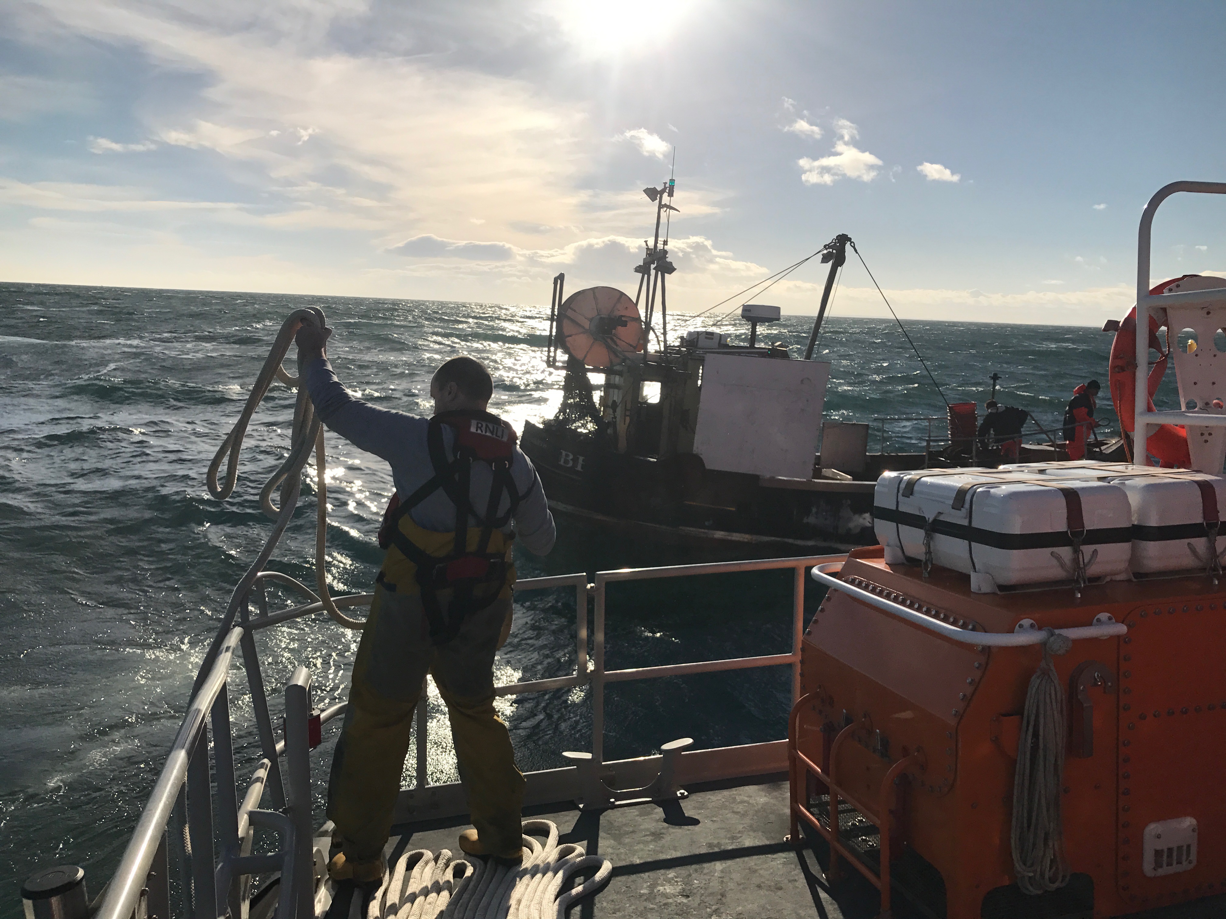 Tynemouth RNLI all weather lifeboat and her volunteer crew rescue a fishing boat with two fisherman on board after it became stranded 12 miles north of the river Tyne. This photo: An RNLI volunteer gets the tow rope ready. Photo: Michael Brown