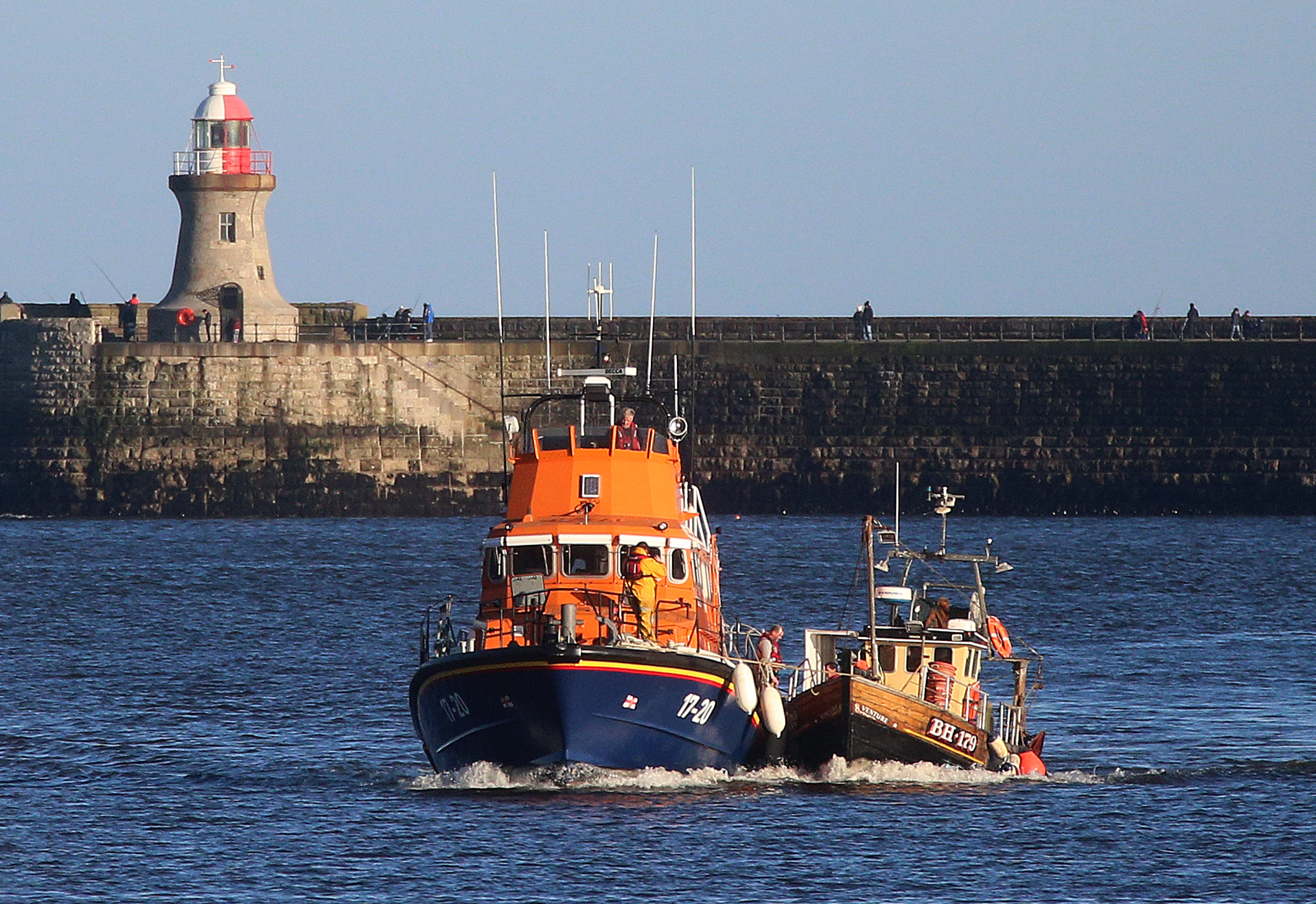 04 Feb 2017 Tynemouth RNLI all weather lifeboat and her volunteer crew rescue a fishing boat with two fisherman on board after it became stranded 12 miles north of the river Tyne. This photo: The lifeboat tows the fishing boat alongside for the last leg of the tow into the river Tyne. Photo: Adrian Don.