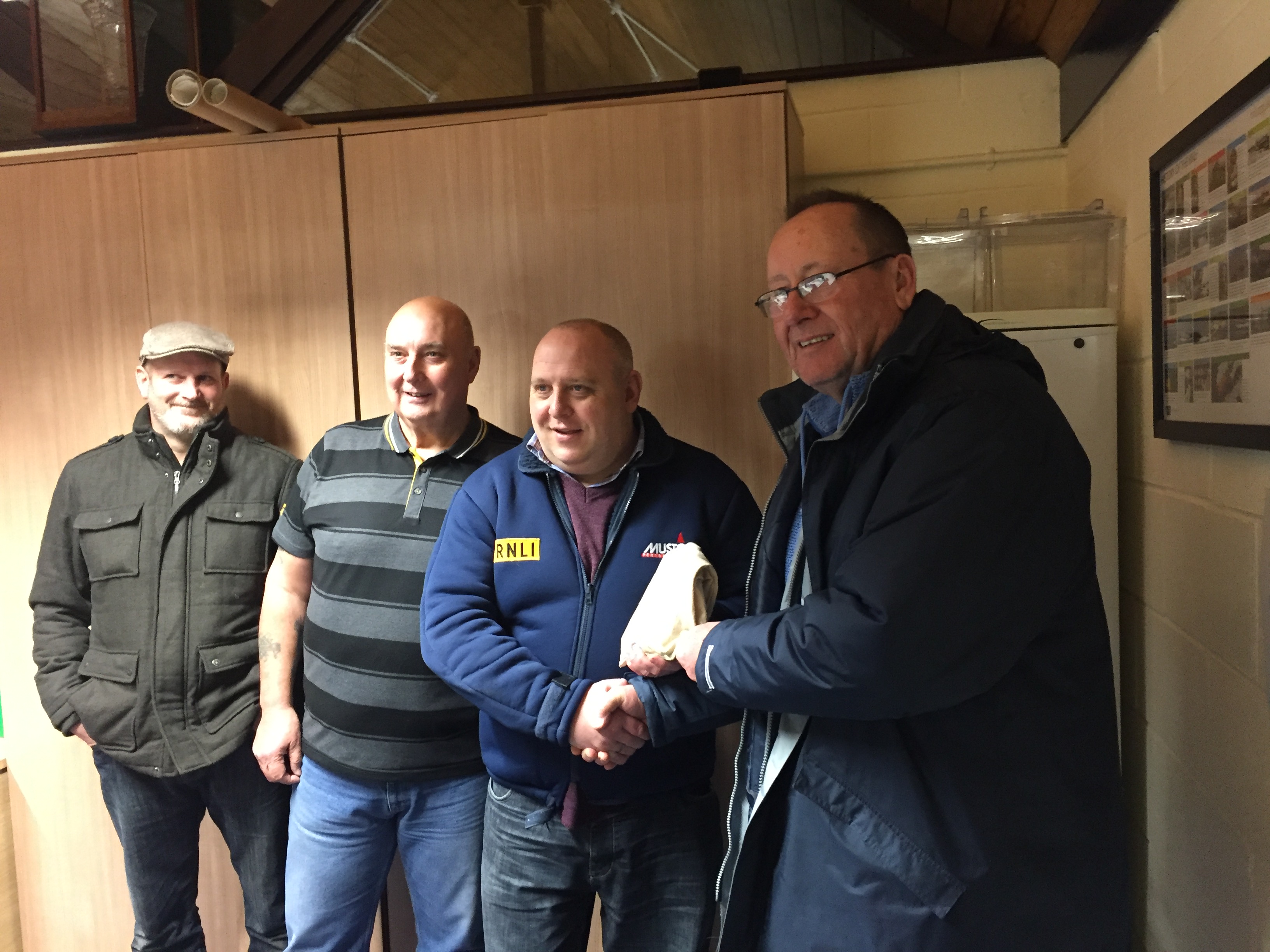 Roy Morgan presenting funds to Jason Dunlop