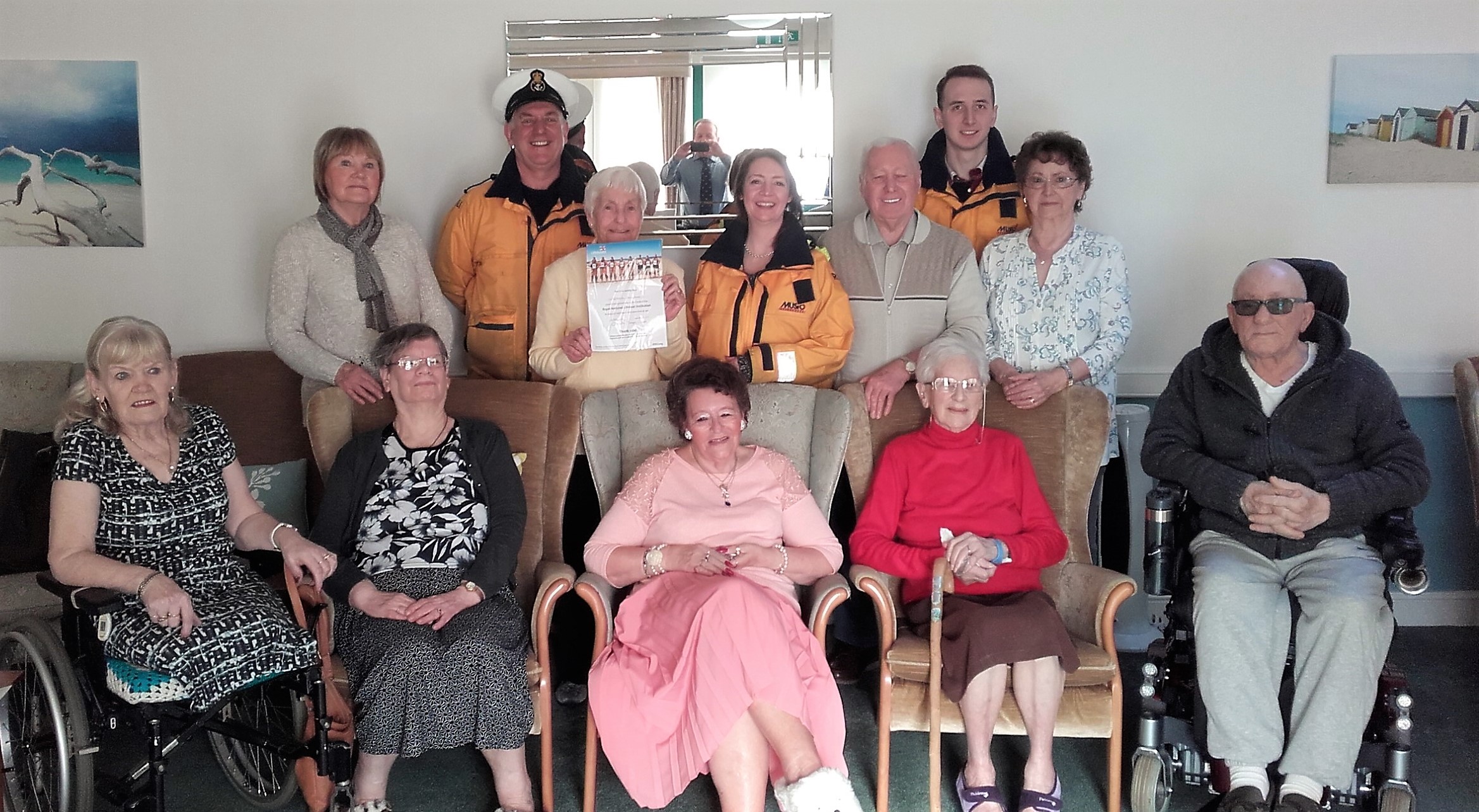 The photograph shows residents from Welbeck House, with Fleetwood volunteer lifeboat crew members Tony Cowell, Angie Sanderson and Jonathon Davies.
