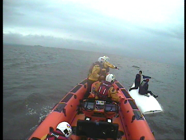 Rescue of two males from capsized dinghy off Portobello (37-16)
