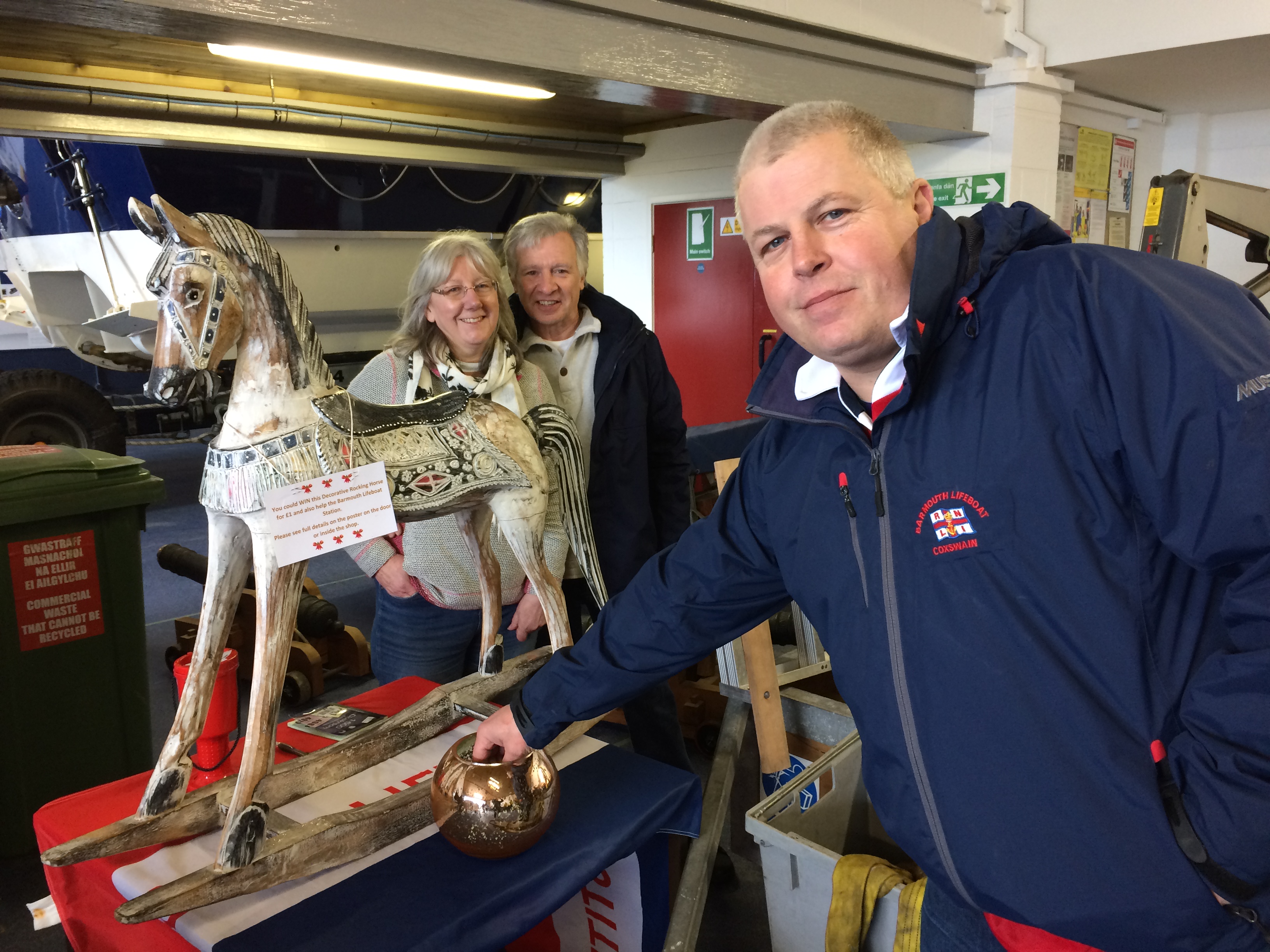 Coxswain Pete Davies draws the raffle for the rocking horse