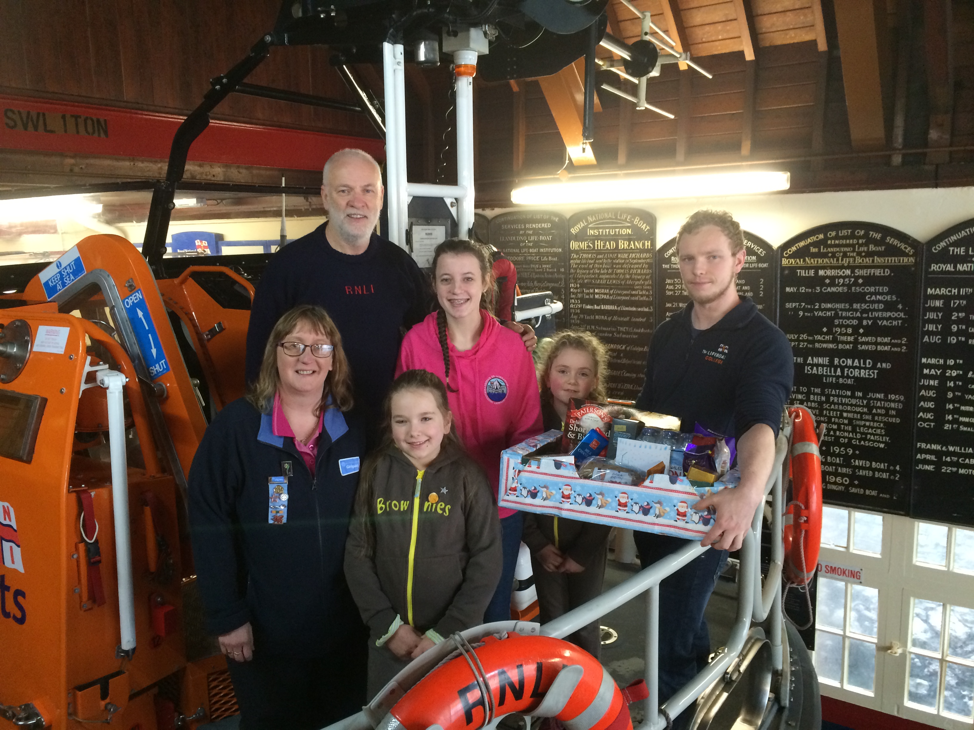 Brown Owl and her Brownies are pictured on board Llandudno's lifeboat 'Andy Pearce' with RNLI crew members Les Jones and Luke Heritage