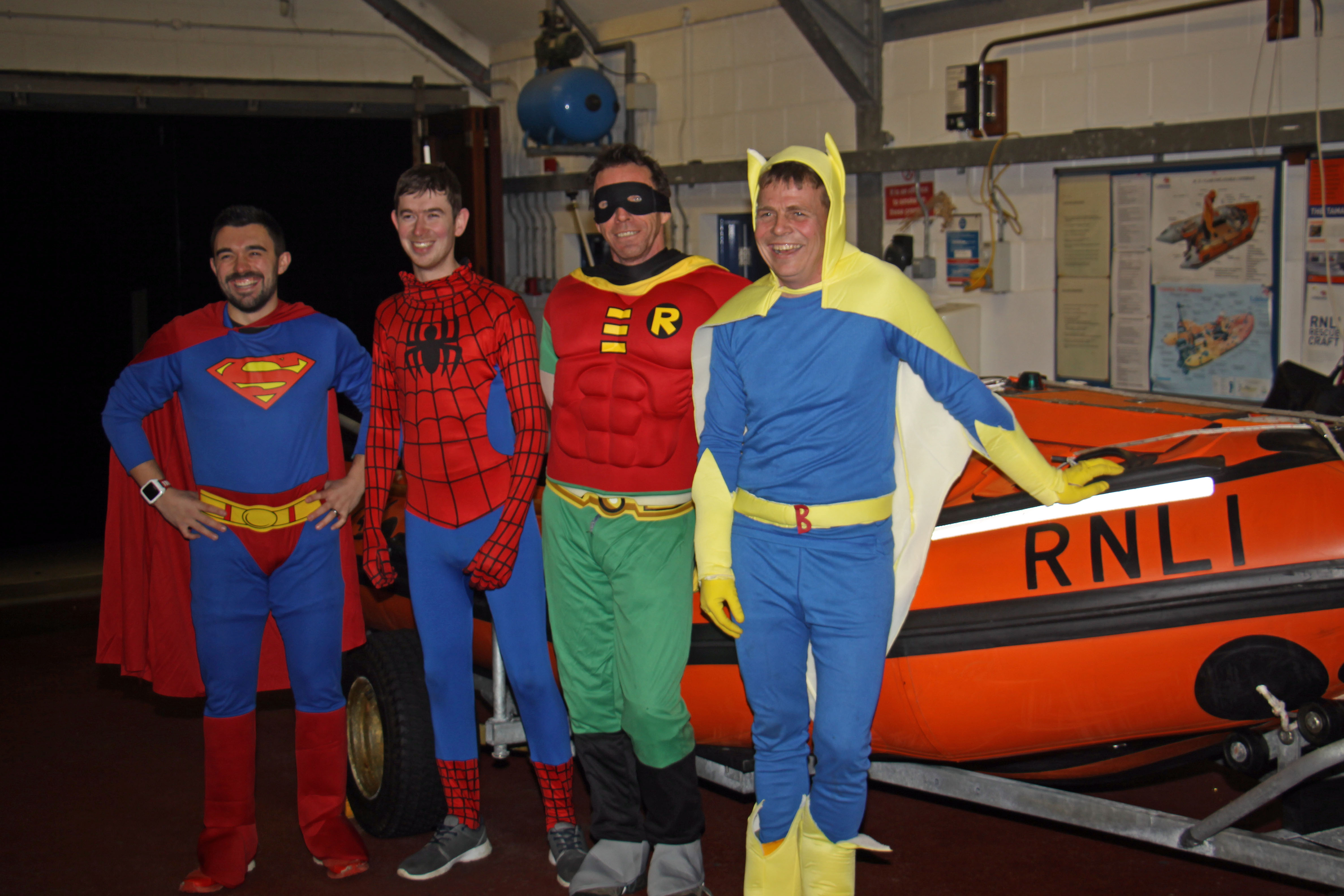 Looe RNLI's 'superheroes' pictured in front of the D class lifeboat