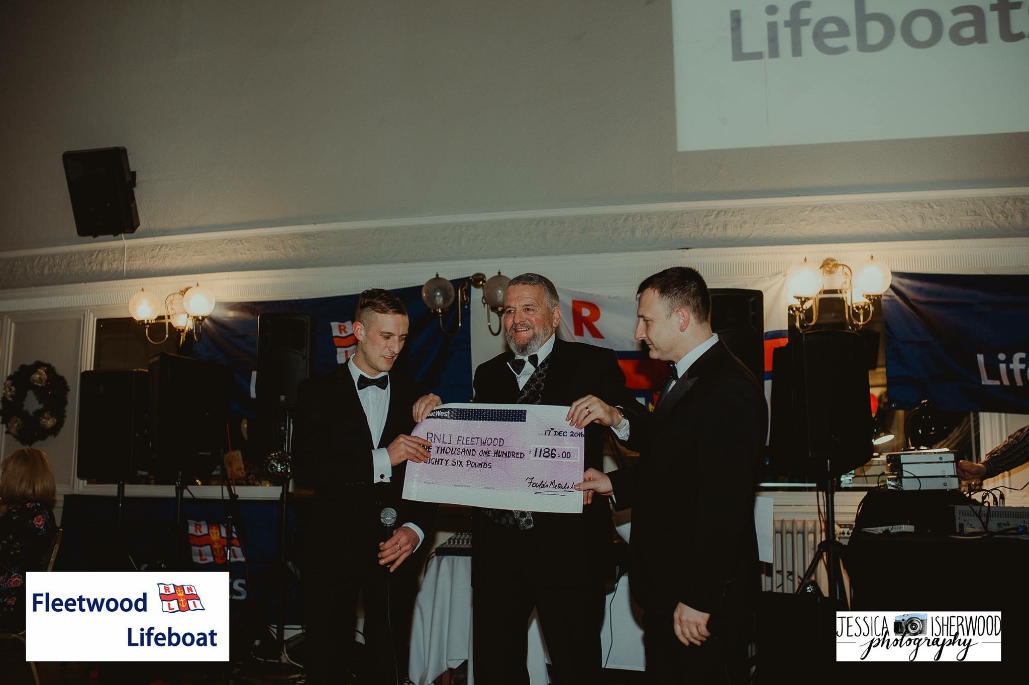 Cheque presentation from Liam Barnes, of Foulds Metals to Captain David Eccles and Coxswain Gary Randles of Fleetwood RNLI