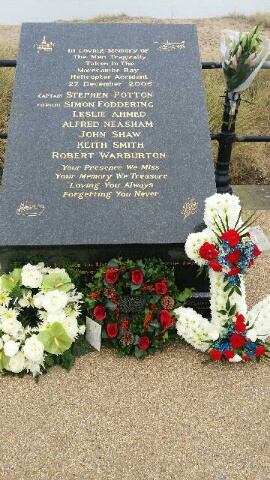 Commemorative monument in memory of the 7 workers and crew who lost their lives, with wreaths from RNLI stations who took part in the operation.