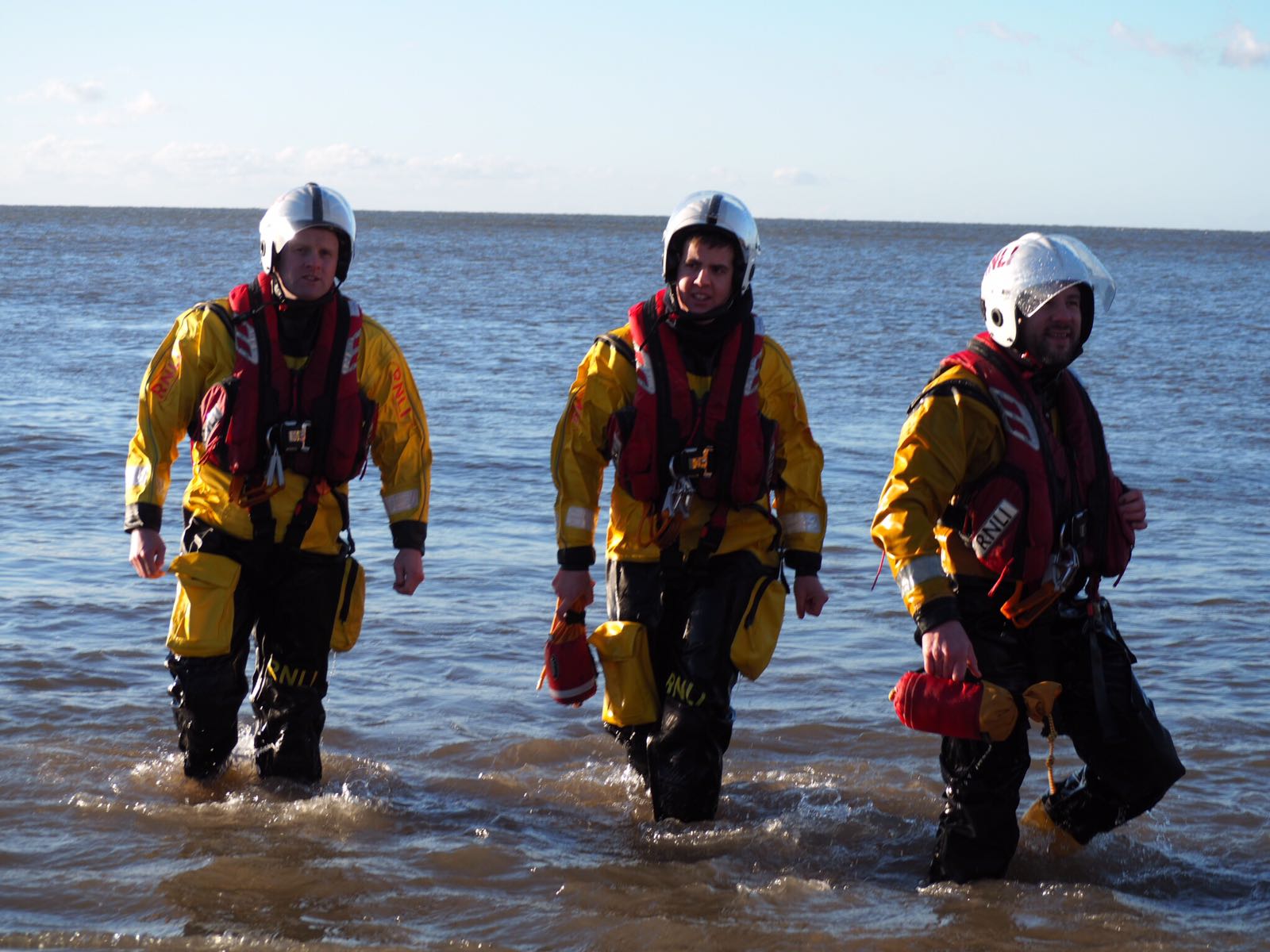 Three of our volunteers on standby in case anyone gets into difficulties during the swim