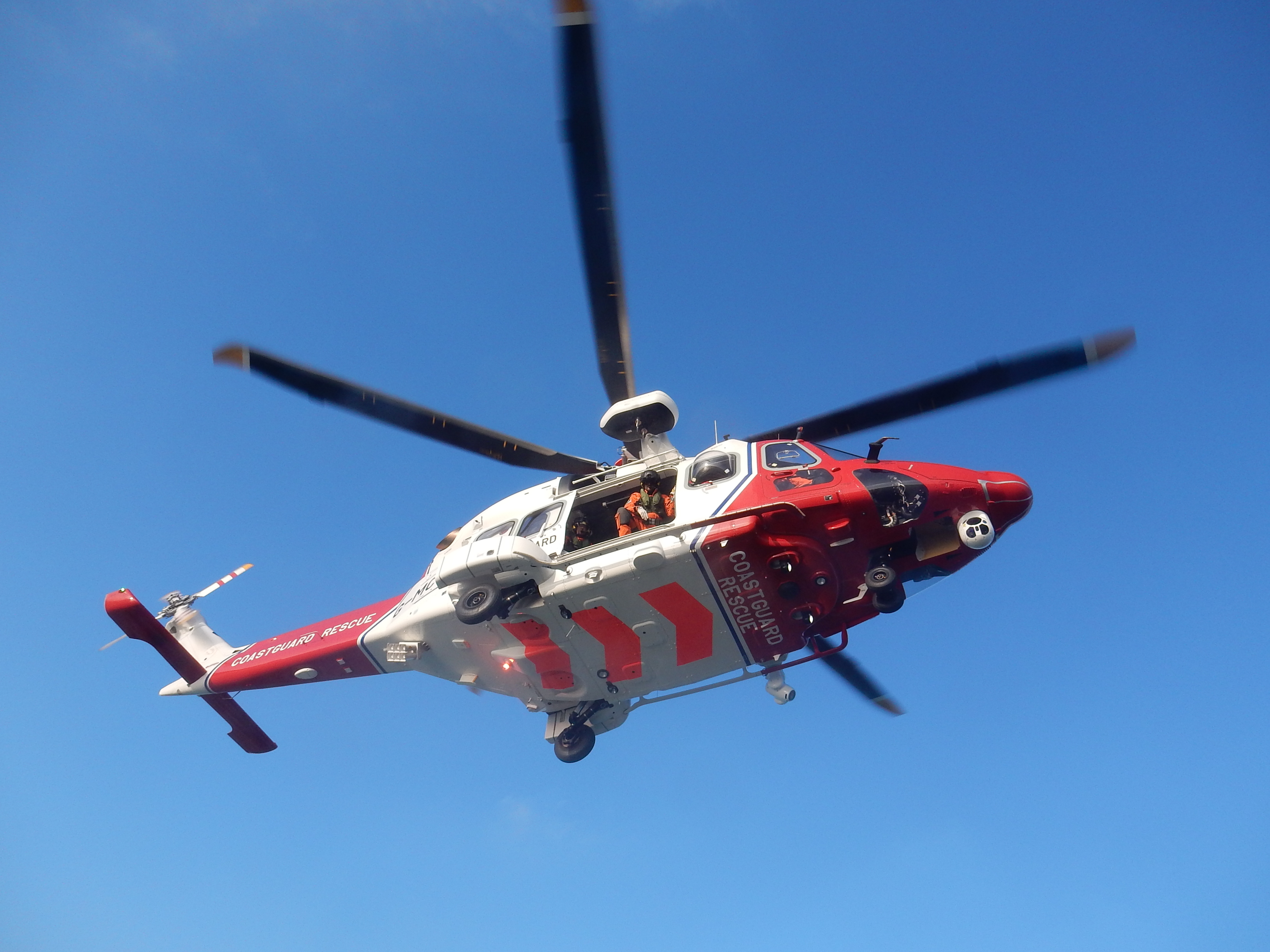 New AW189 Coastguard helicopter hovering above the RNLI's Yarmouth lifeboat