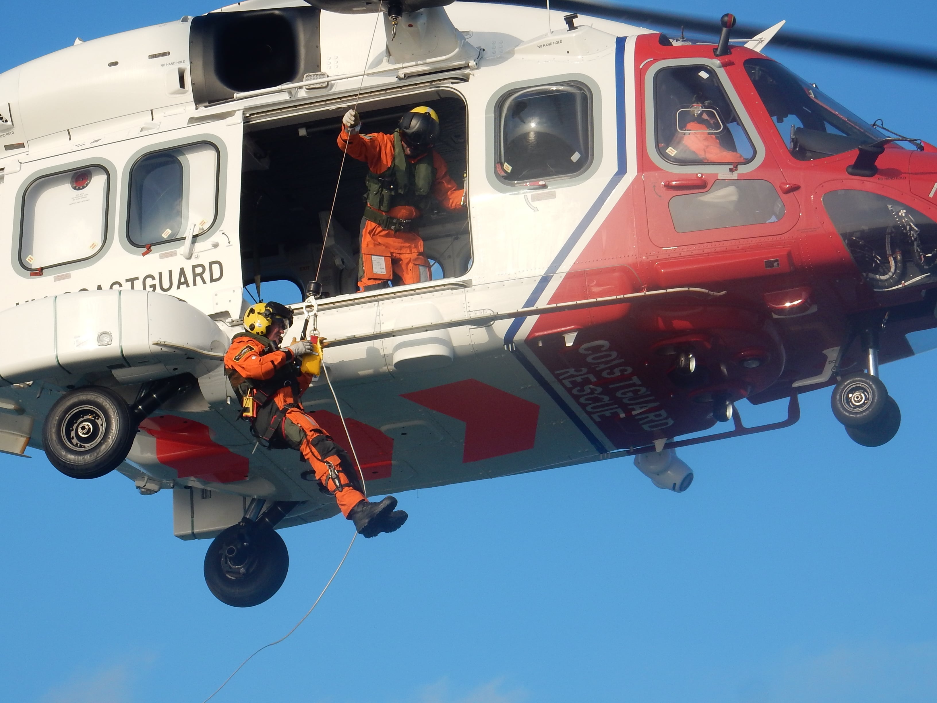 Winchman descending to the RNLI's Yamouth lifeboat from the new AW189 Coastguard helicopter.