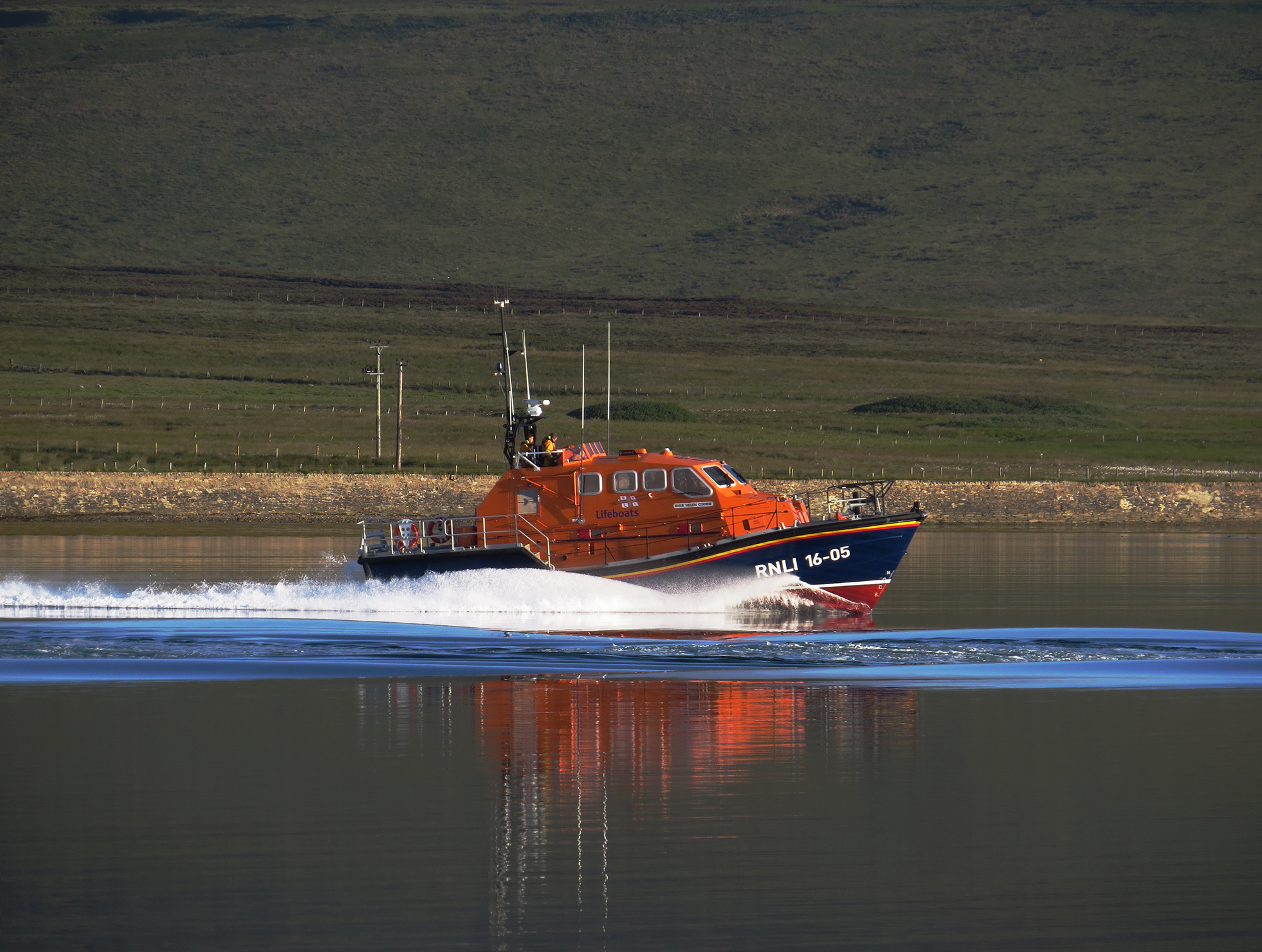 RNLI Longhope Lifeboat launched this morning on service, heading up Longhope Bay.