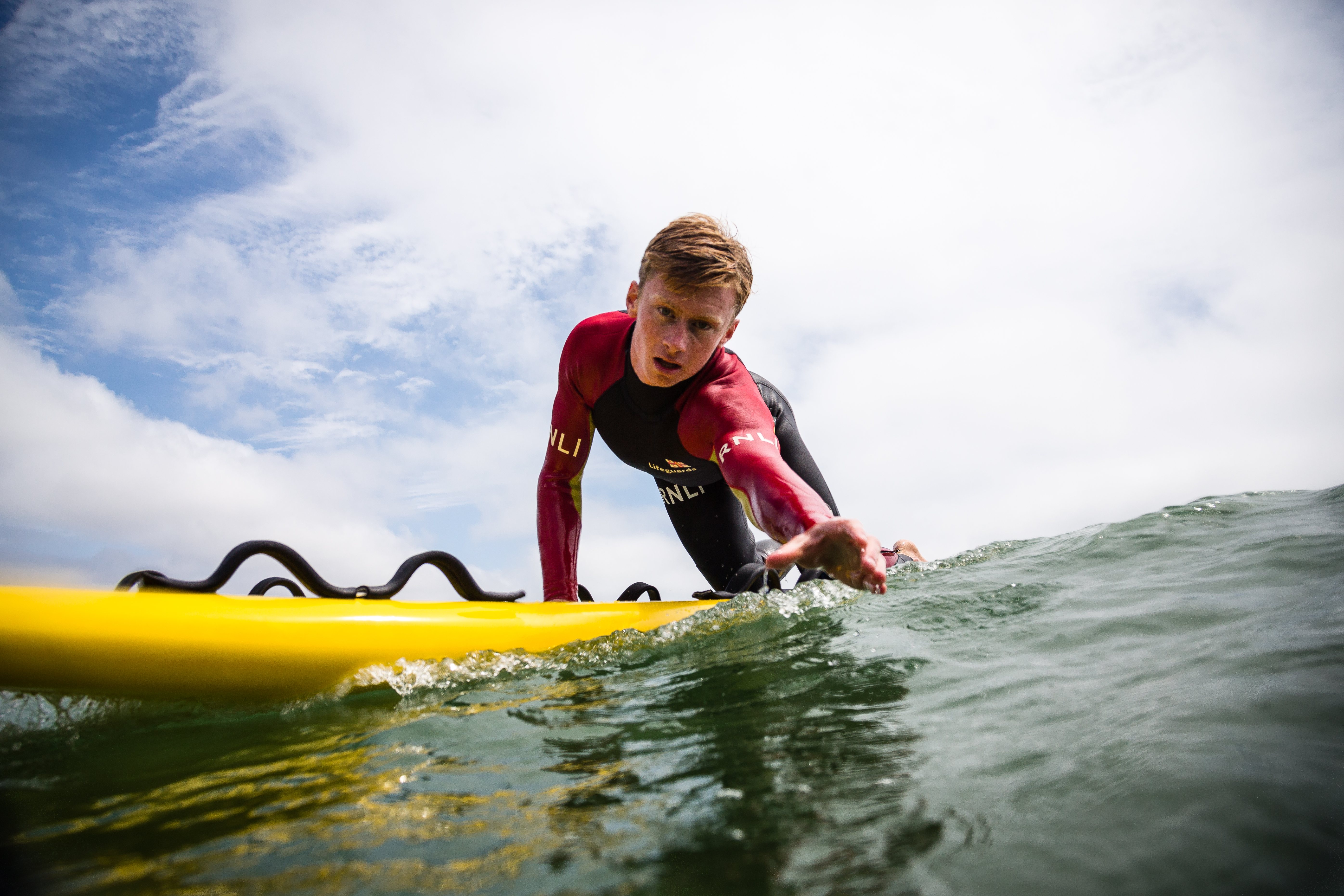 A stock photo of an RNLI lifeguard in action