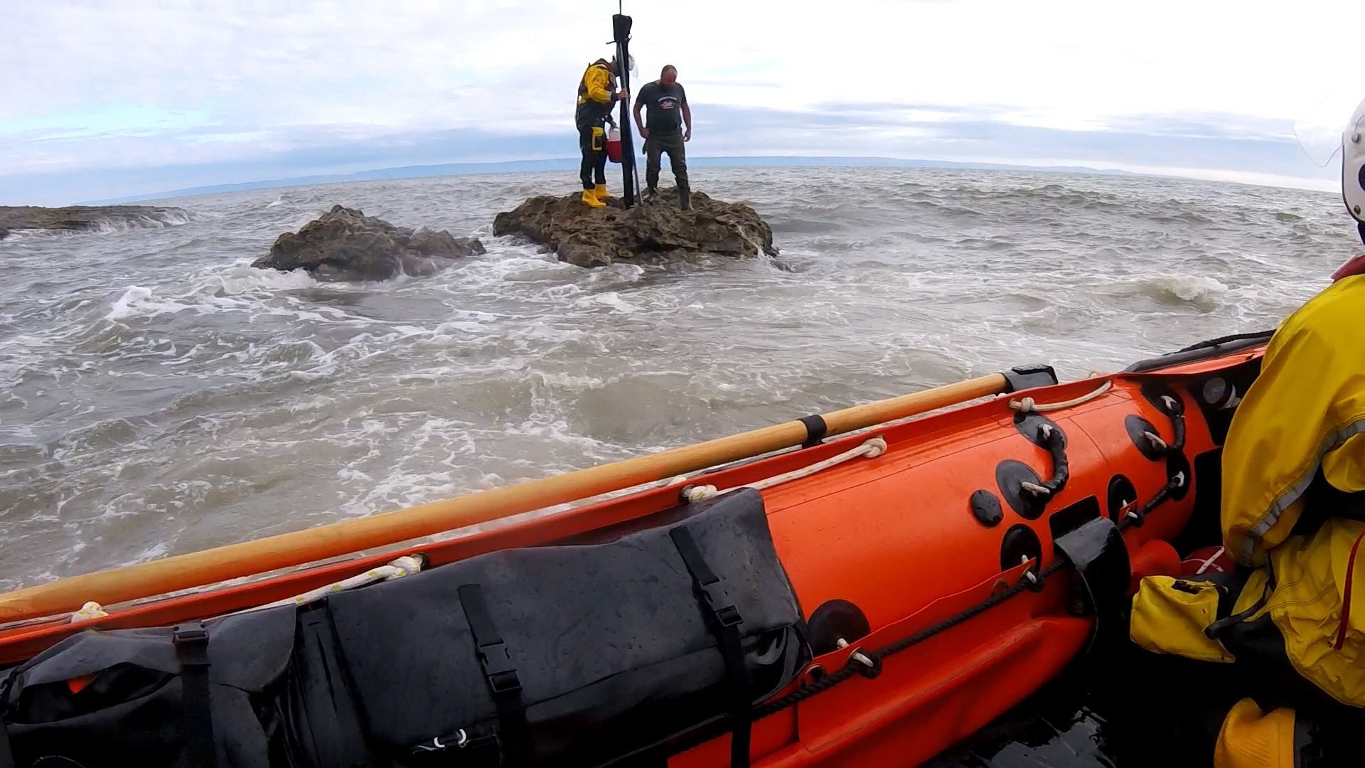 Crew member Chris Missen assisting the fisherman and prparing for the rescue.